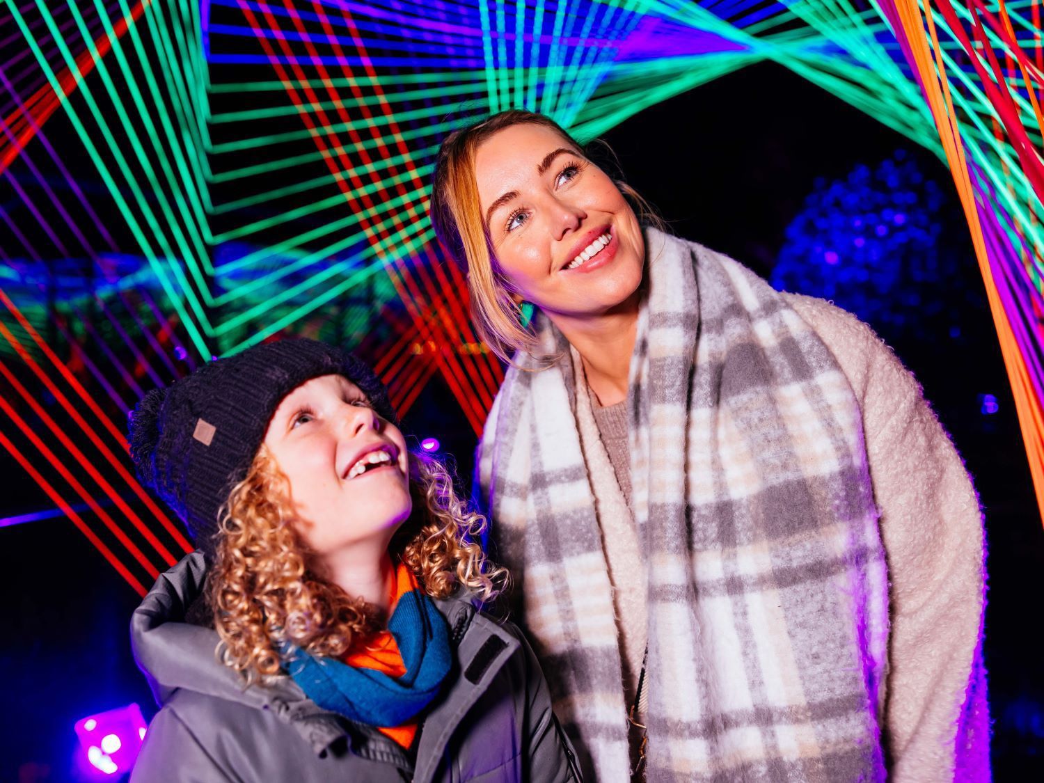 Mother and son surrounded by a laser light show