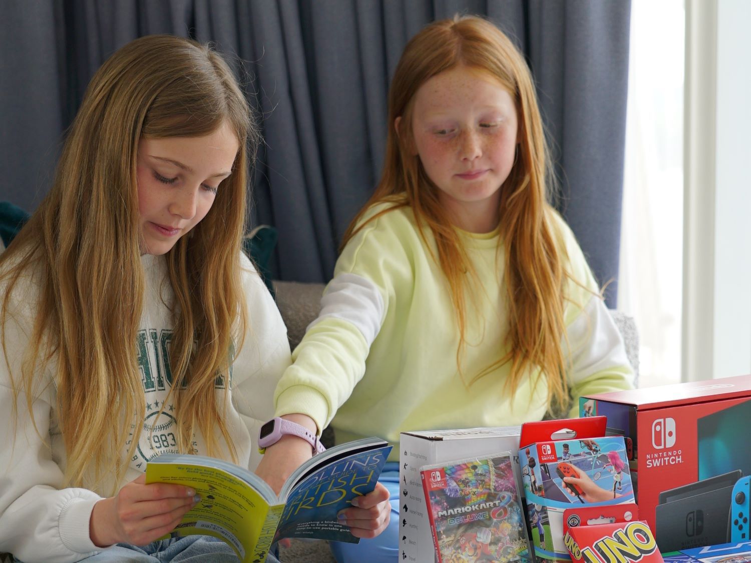 two kids in a hotel room with toys