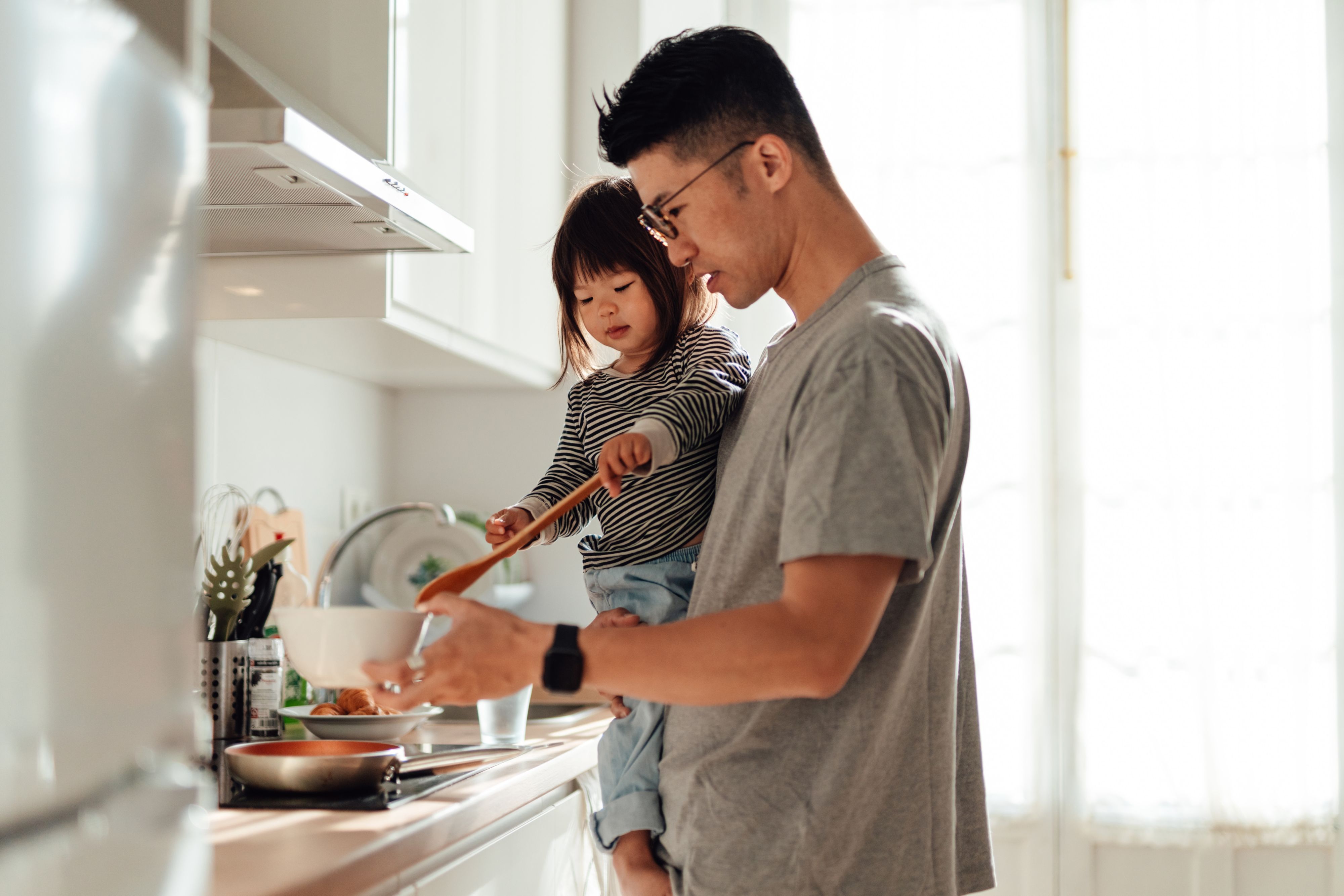 Guest in a suite kitchen with ingredients on the worktop