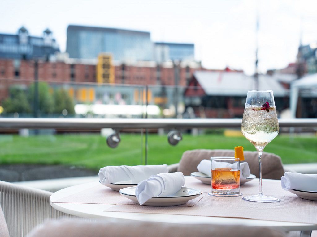 Crafted cocktails on Matria’s patio overlooking the Boston Harbor 