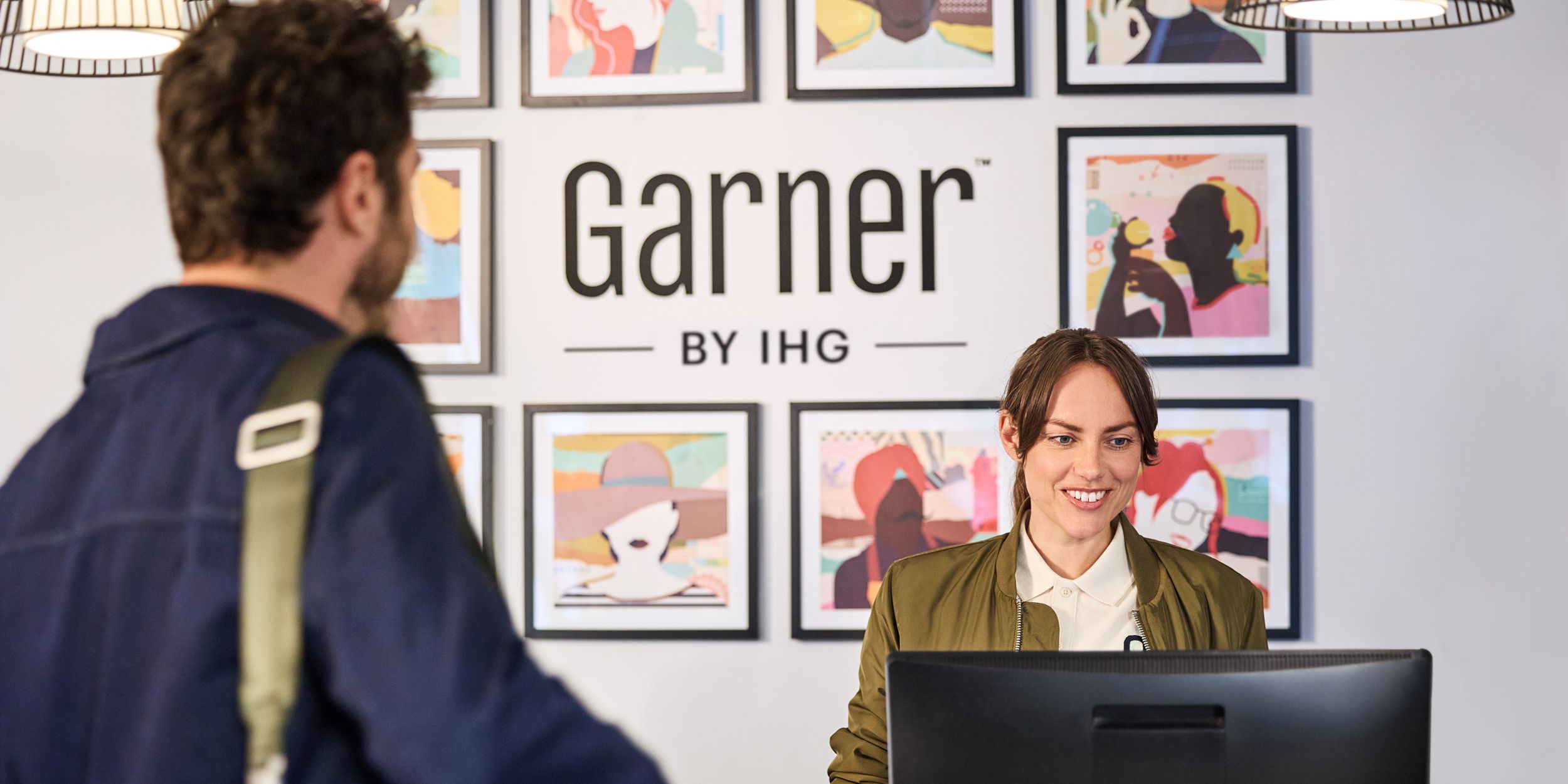 Guest being checked into a Garner hotel by check in agent
