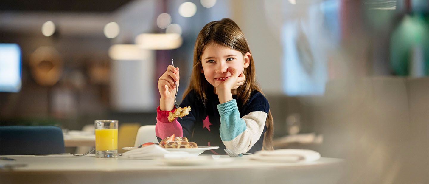 Young girl eating food