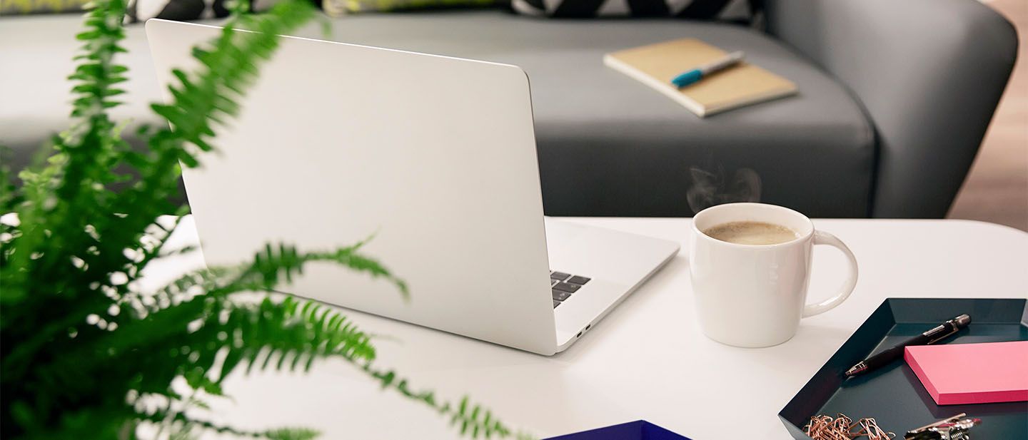 laptop and coffee on table
