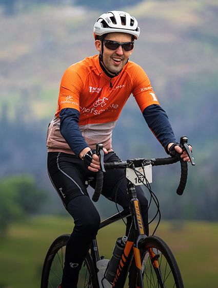 man in cycling gear riding a bike