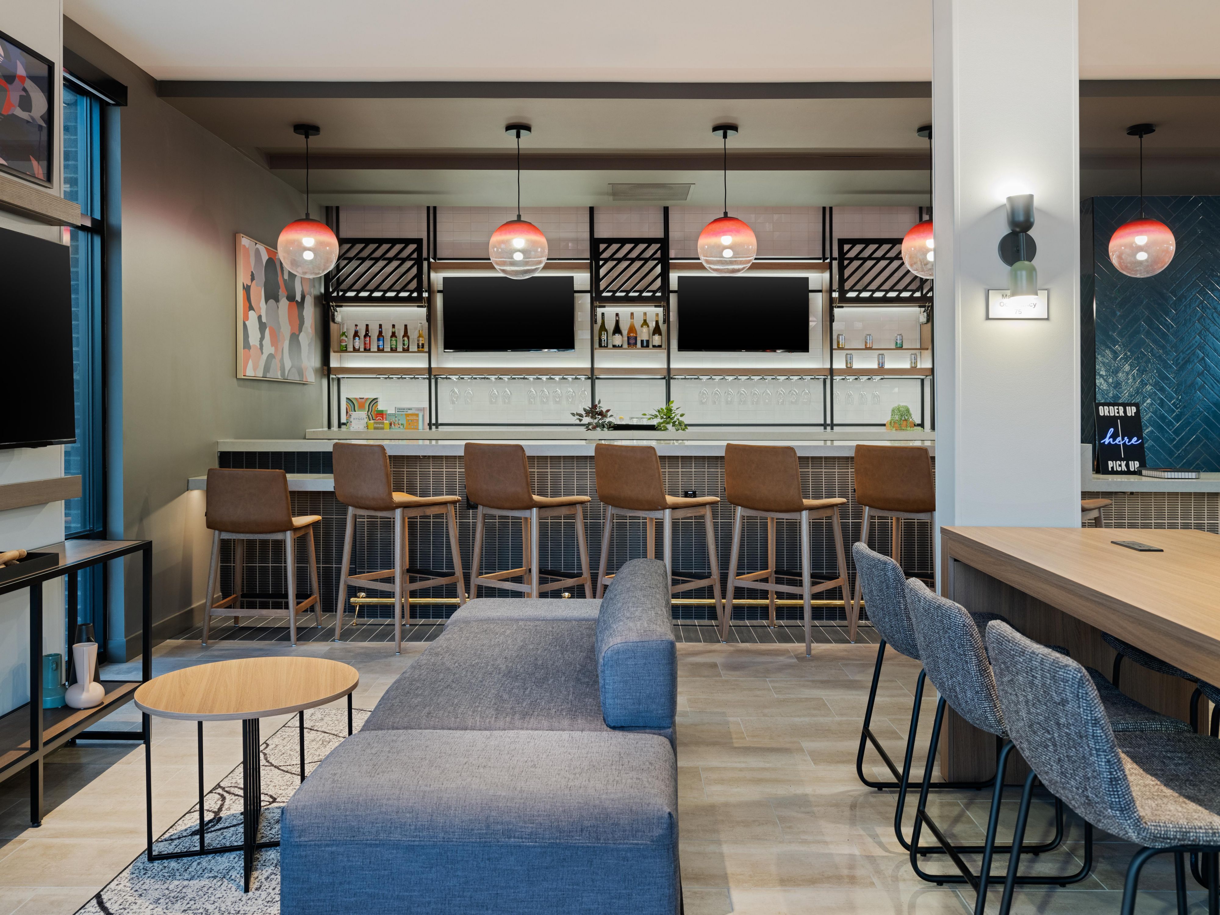 Unwind in our cozy bar, open evenings, offering a selection of shareable small plates perfect for socializing. Enjoy a curated menu featuring veggie burgers, sliders, wings, and flatbreads fit for any palate. Pair these savory bites with a refreshing drink from the bar for a satisfying end to your day.