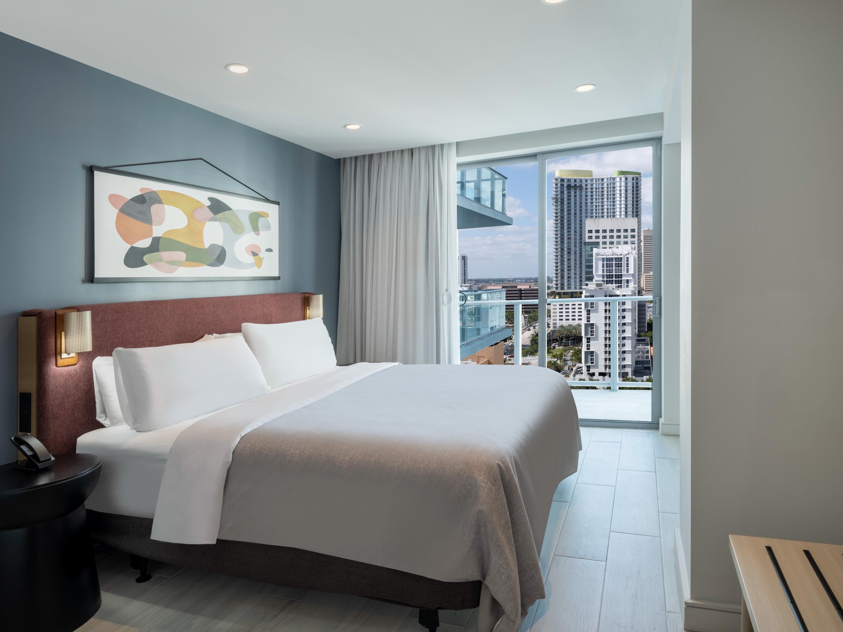 Our spacious suites are perfect for families traveling together, featuring a sleeper sofa and an extra half bathroom for added convenience. Enjoy a wet bar, mini fridge, and microwave, along with a cozy lounge and spa-inspired bathroom, all while taking in stunning views from your walk-out balcony. 