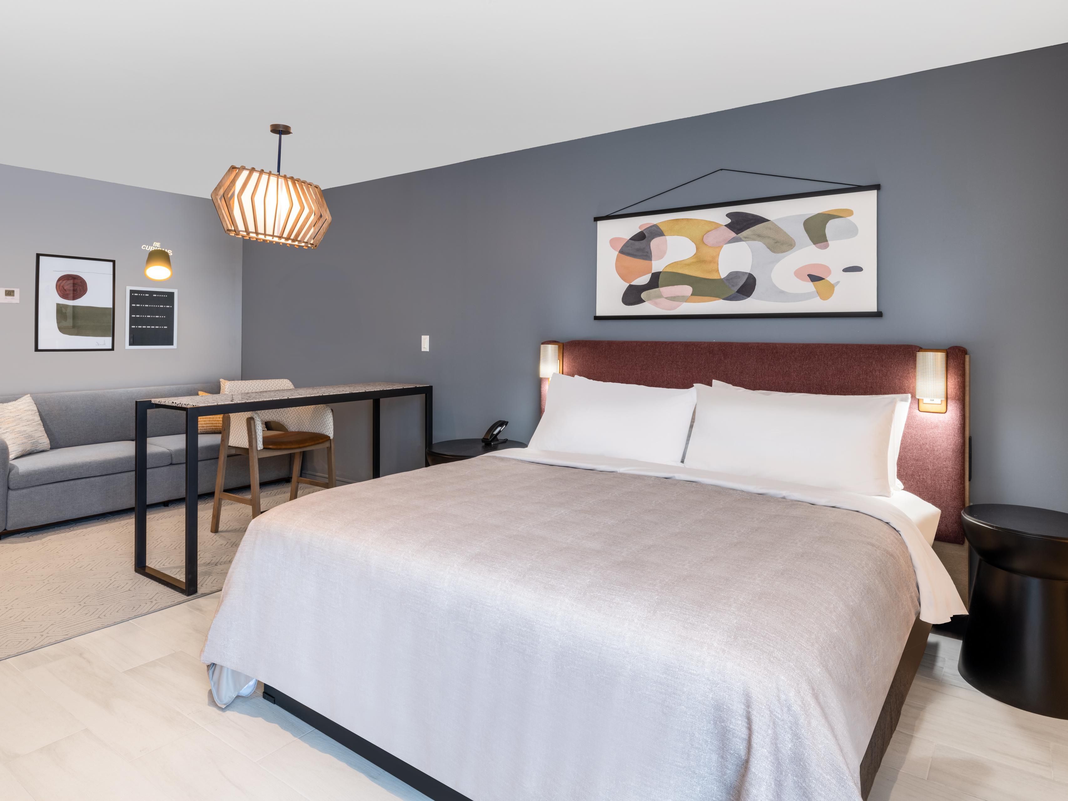 Spacious modern suites include lounge area and standing desk.