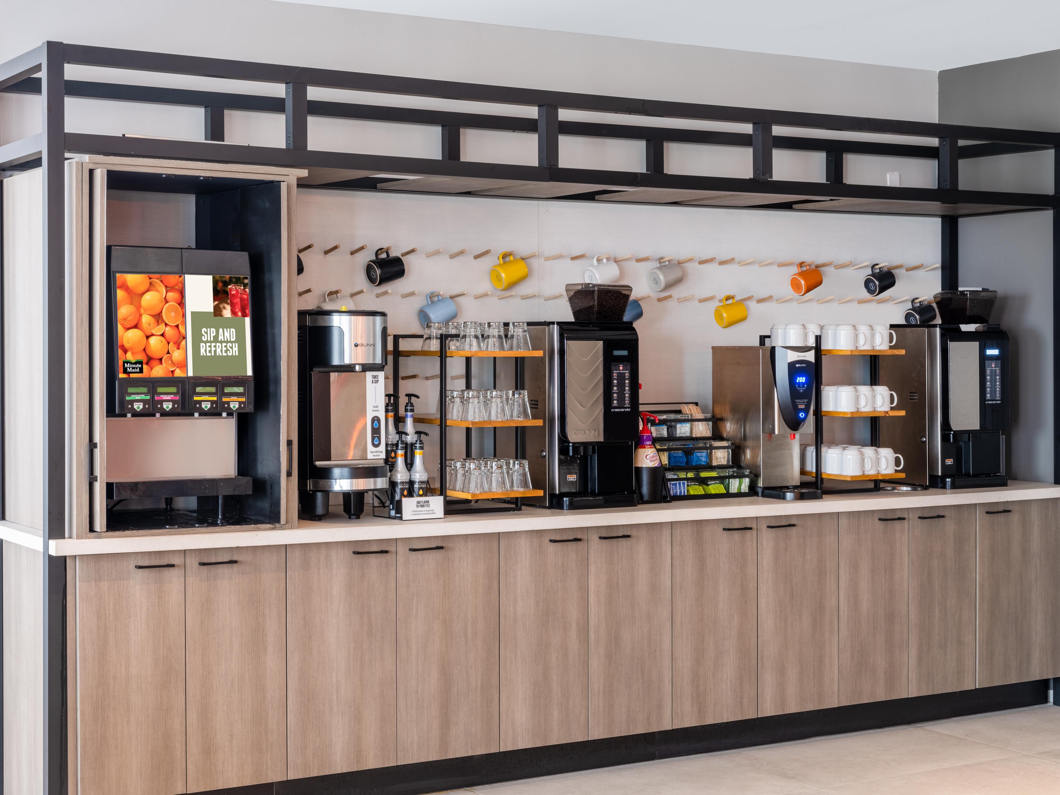 Beverage station with plenty of glasses and drink options