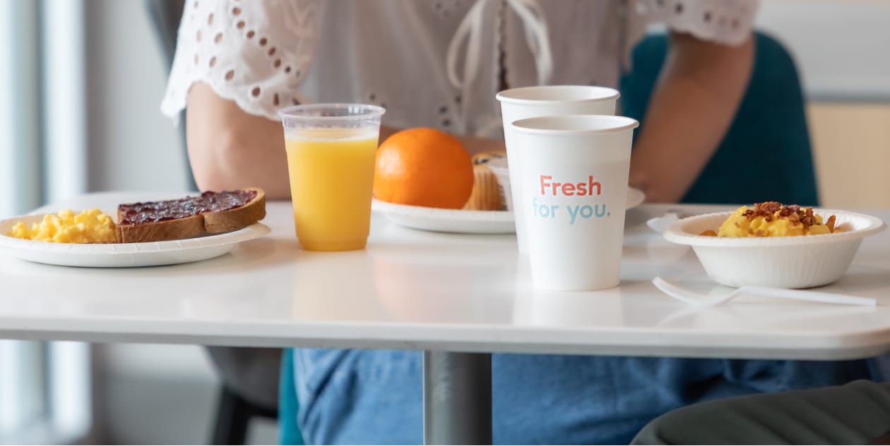 Delicious, hot, hotel breakfast laid out on table.