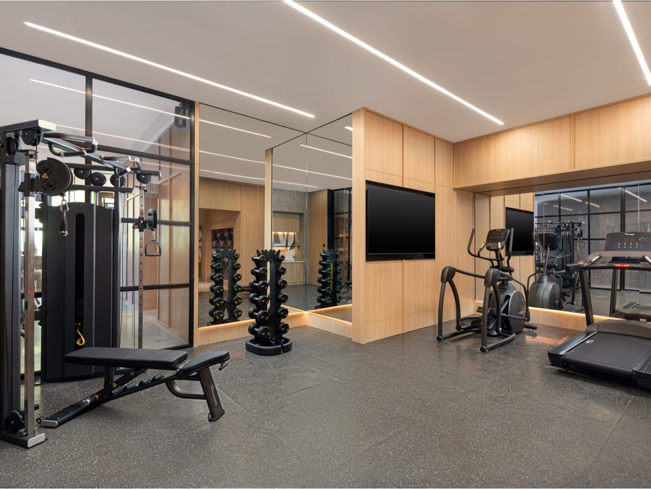 A modern gym with various exercise equipment