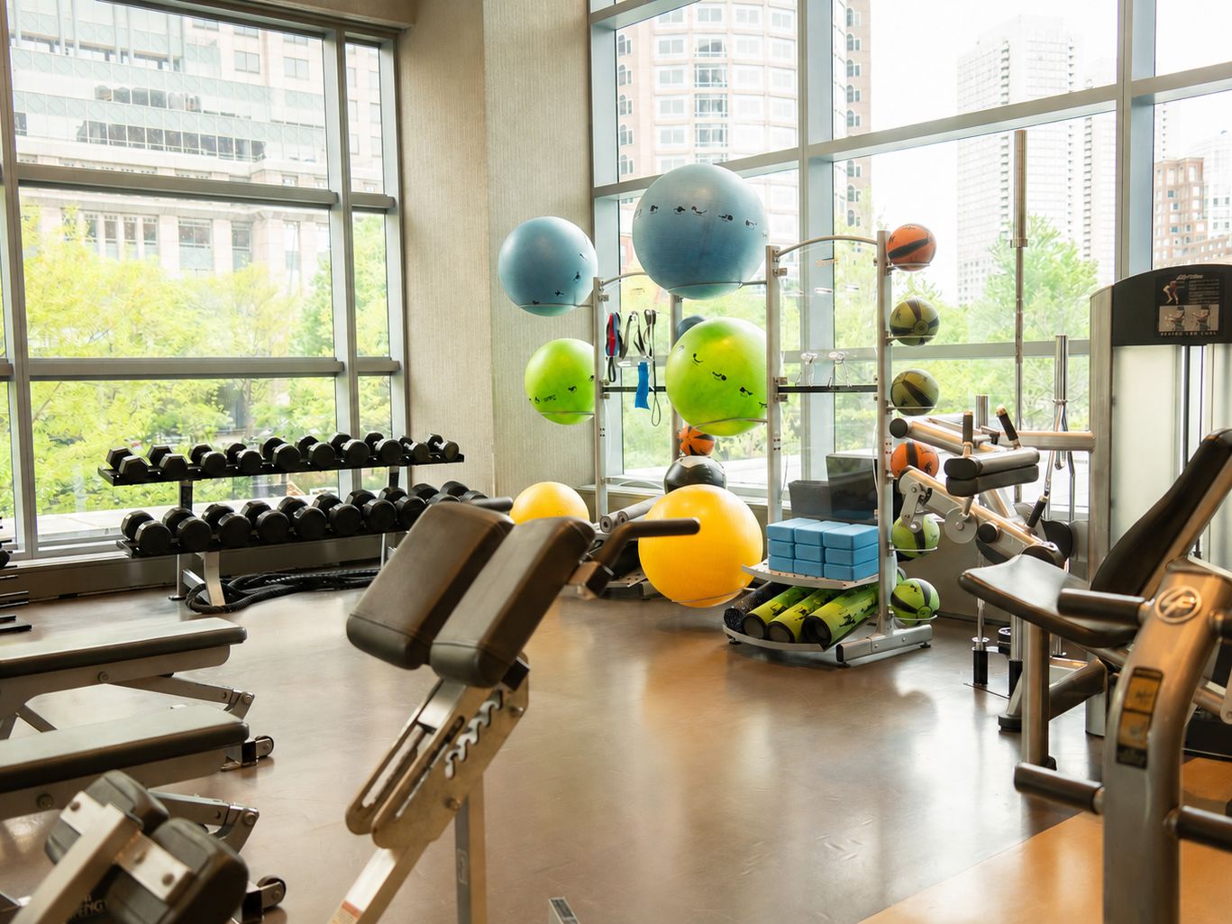 Aerobic machines, weights, and equipment in our Boston hotel fitness center.