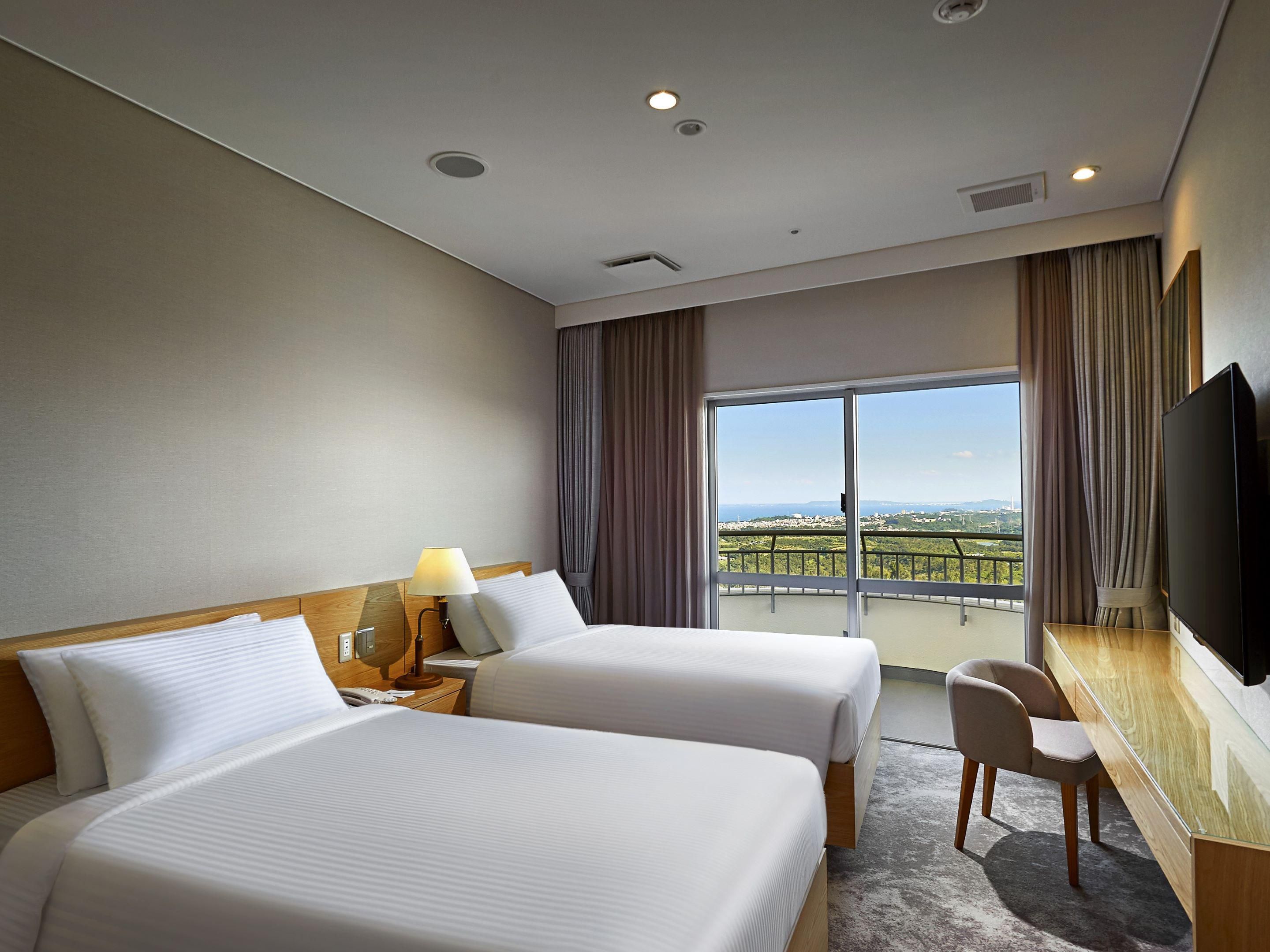 Spend a relaxing time in our spacious rooms, designed for your peace of mind, feeling the freedom of expansive spaces that seem to reach for the sky. Our balconies offer a serene oasis surrounded by lush greenery, capturing the breathtaking highland views unique to Uruma. Enjoy the tranquil mountains and sweeping ocean vistas.