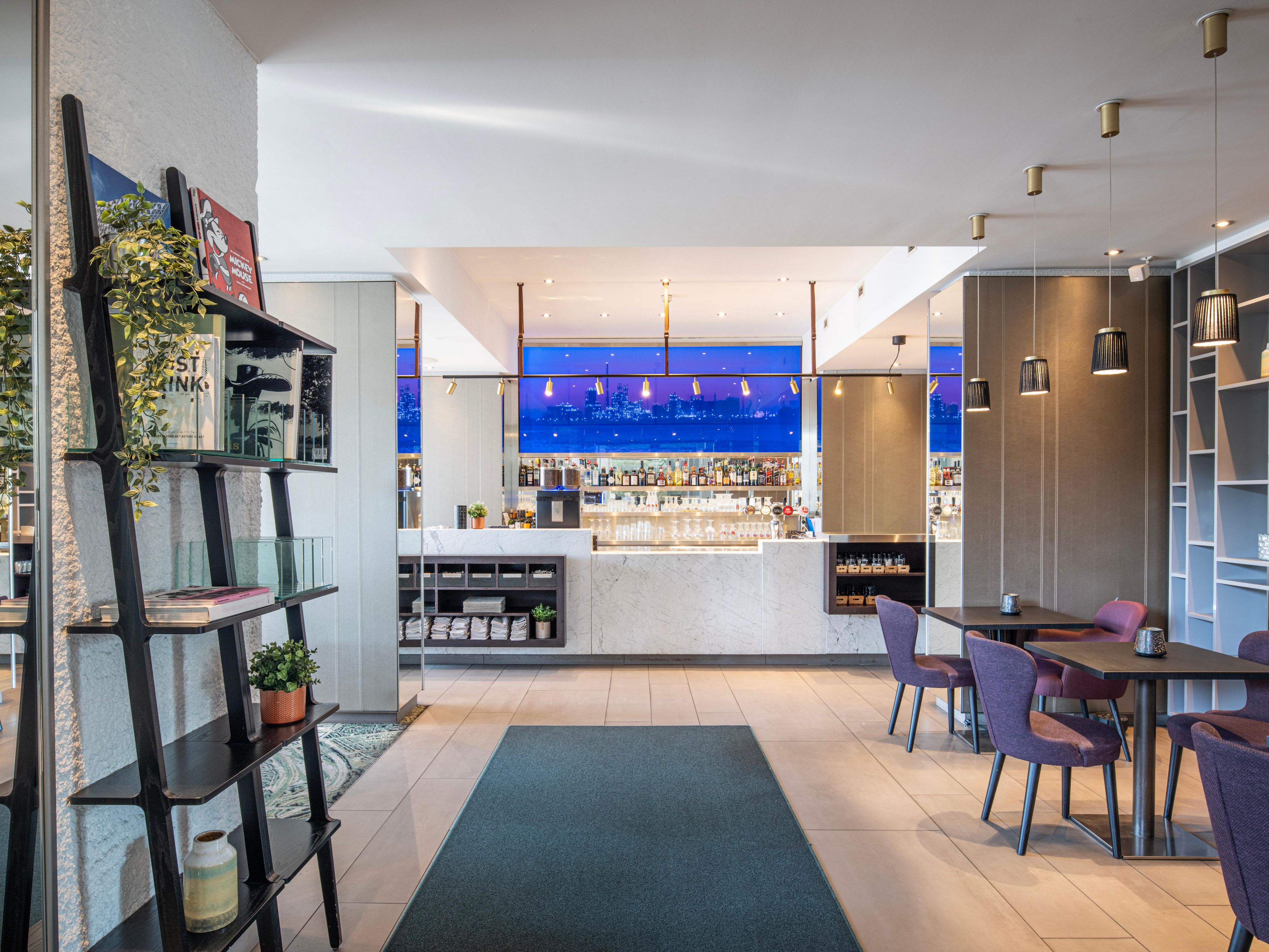 ANNA Living and Bar is our intimate living room-style eatery, where guests and locals relax in easy chairs with Belgian beers and international dishes. The carpet is a Google Earth image of Antwerp, and the local theme continues into the menu.