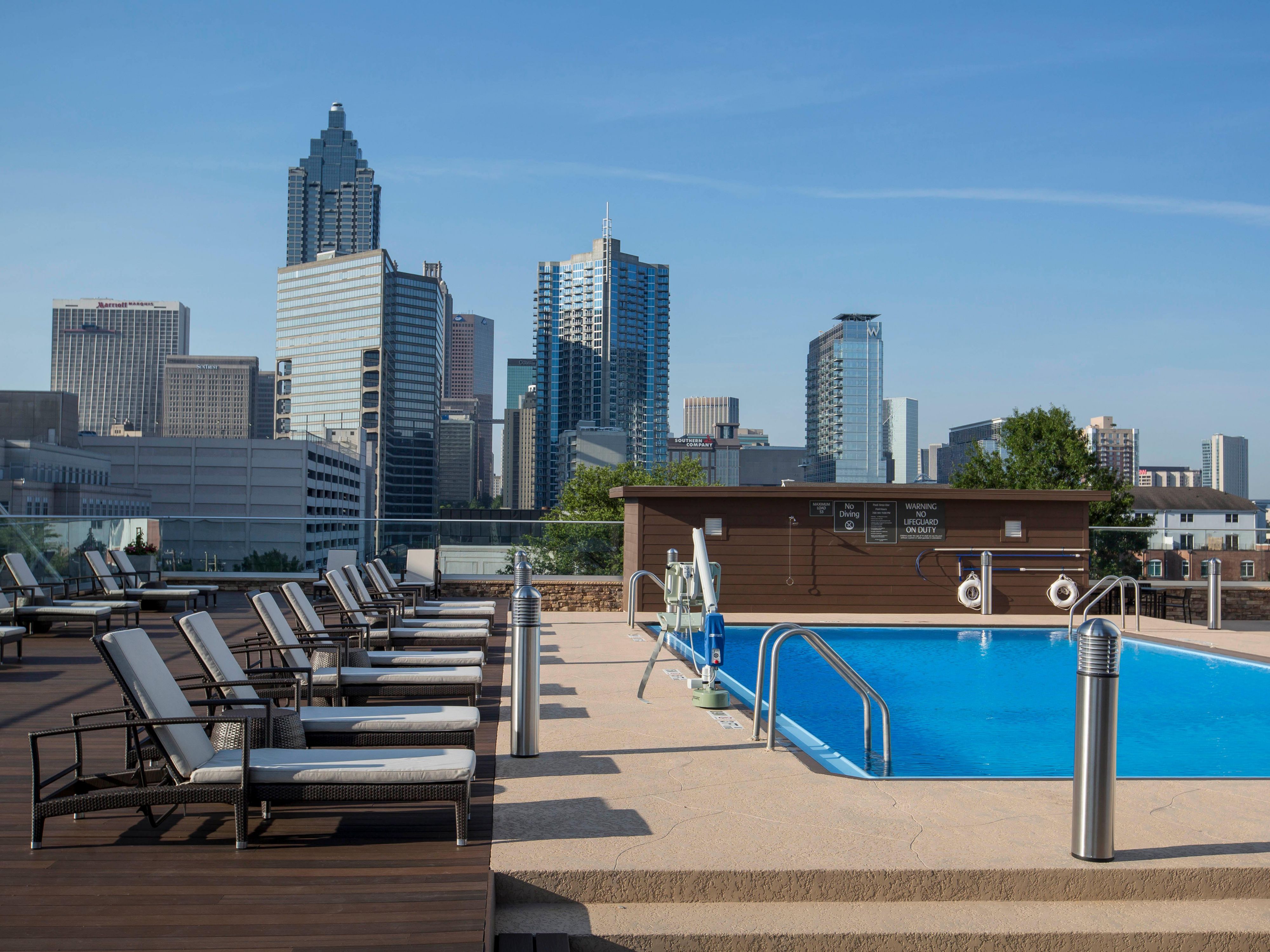 Soak in the sun and take a refreshing dip in our seasonal outdoor rooftop pool, offering stunning views of the Atlanta skyline. Whether you're lounging poolside or enjoying a swim, the magnificent cityscape creates the perfect backdrop for relaxation. Unwind, recharge, and experience the vibrant energy of the city from our exclusive rooftop oasis.