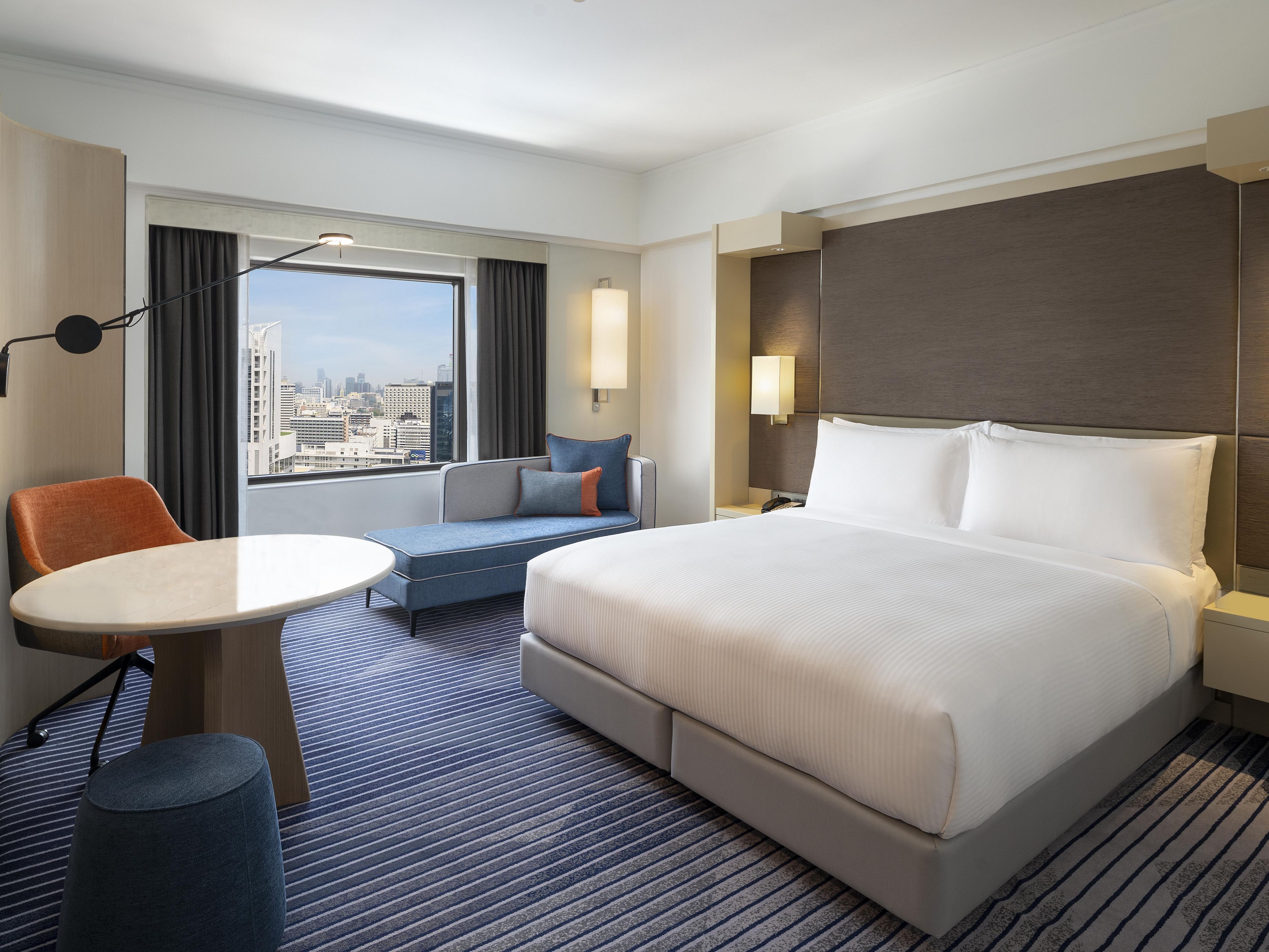 Relax and unwind in the spacious 34 sqm room, available in King size or Twin bedding options. The room offers an ideal blend between comfort and style. It is fitted with a 50″, 4K TV screen with Netflix installed, a dedicated workspace and free Wi-Fi. The bathroom features a high-tech Japanese bidet, a separate shower and bathtub.