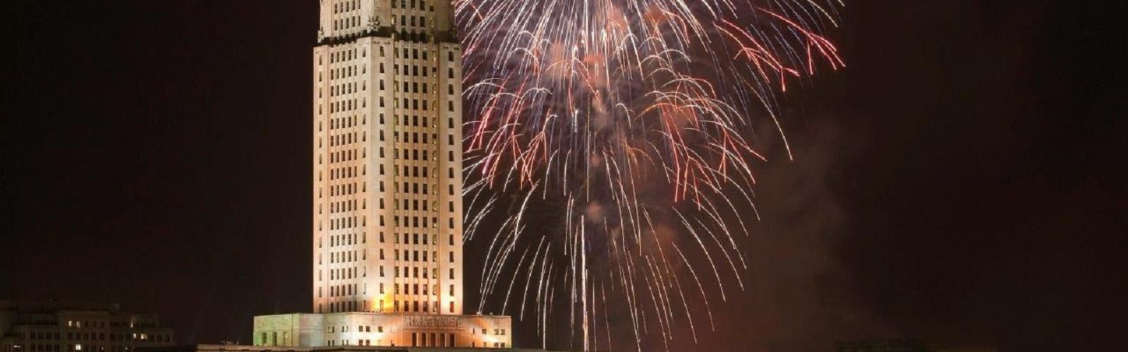Louisiana Capitol aglow - fireworks illuminate the night sky.