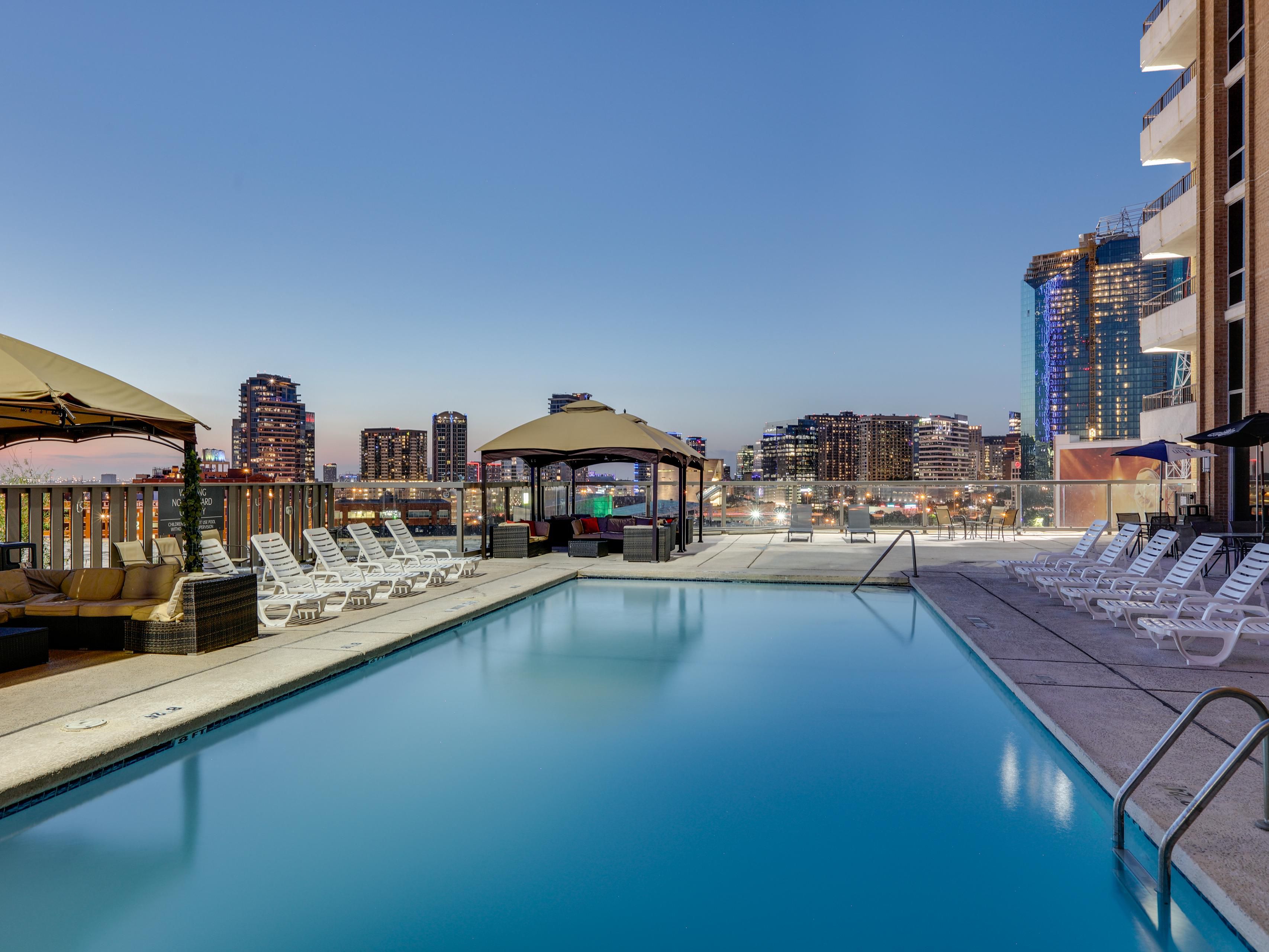 Float above Dallas with skyline views at our hotel rooftop pool.