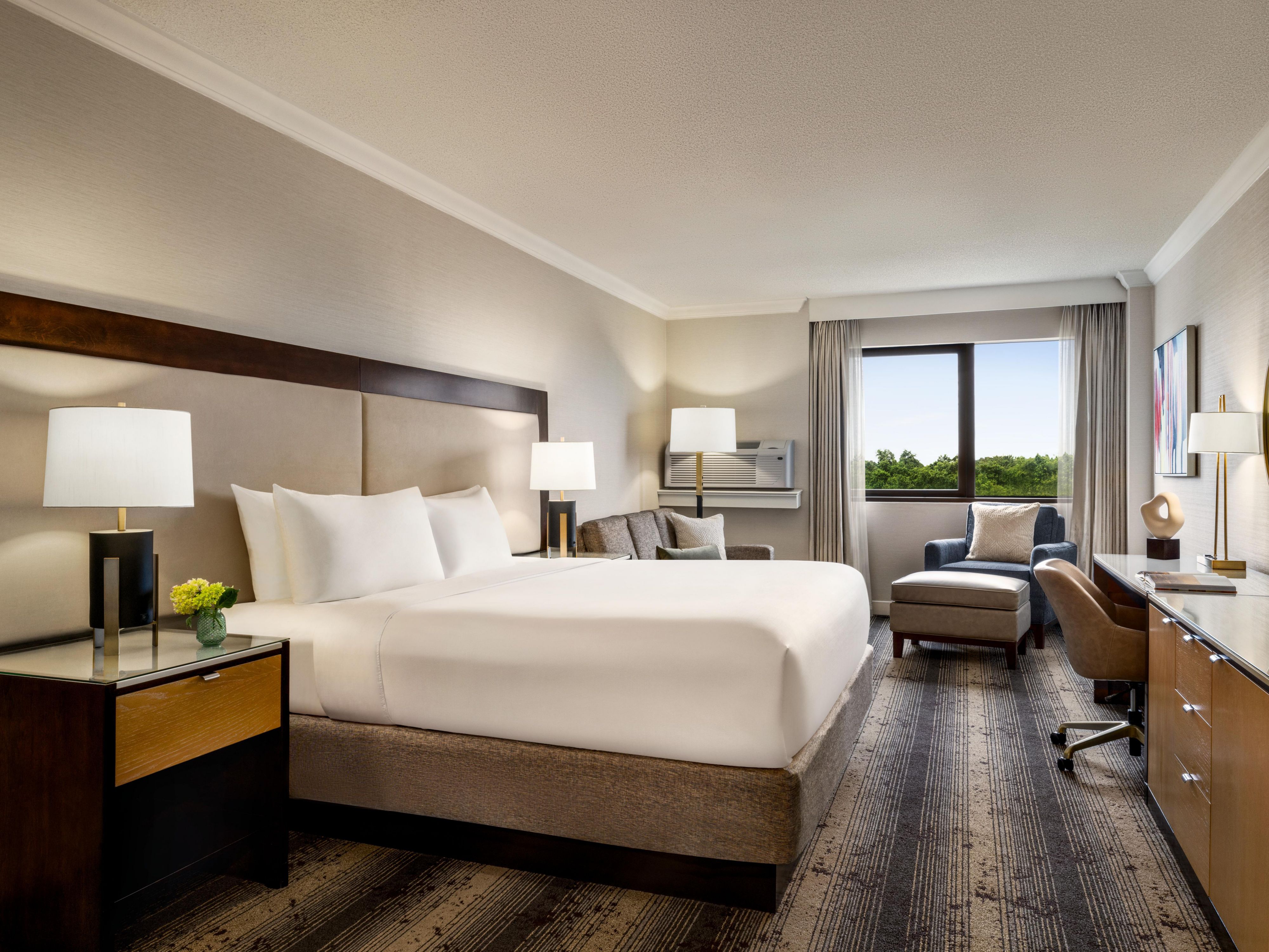 Enjoy private balcony room service with lush greenery views.