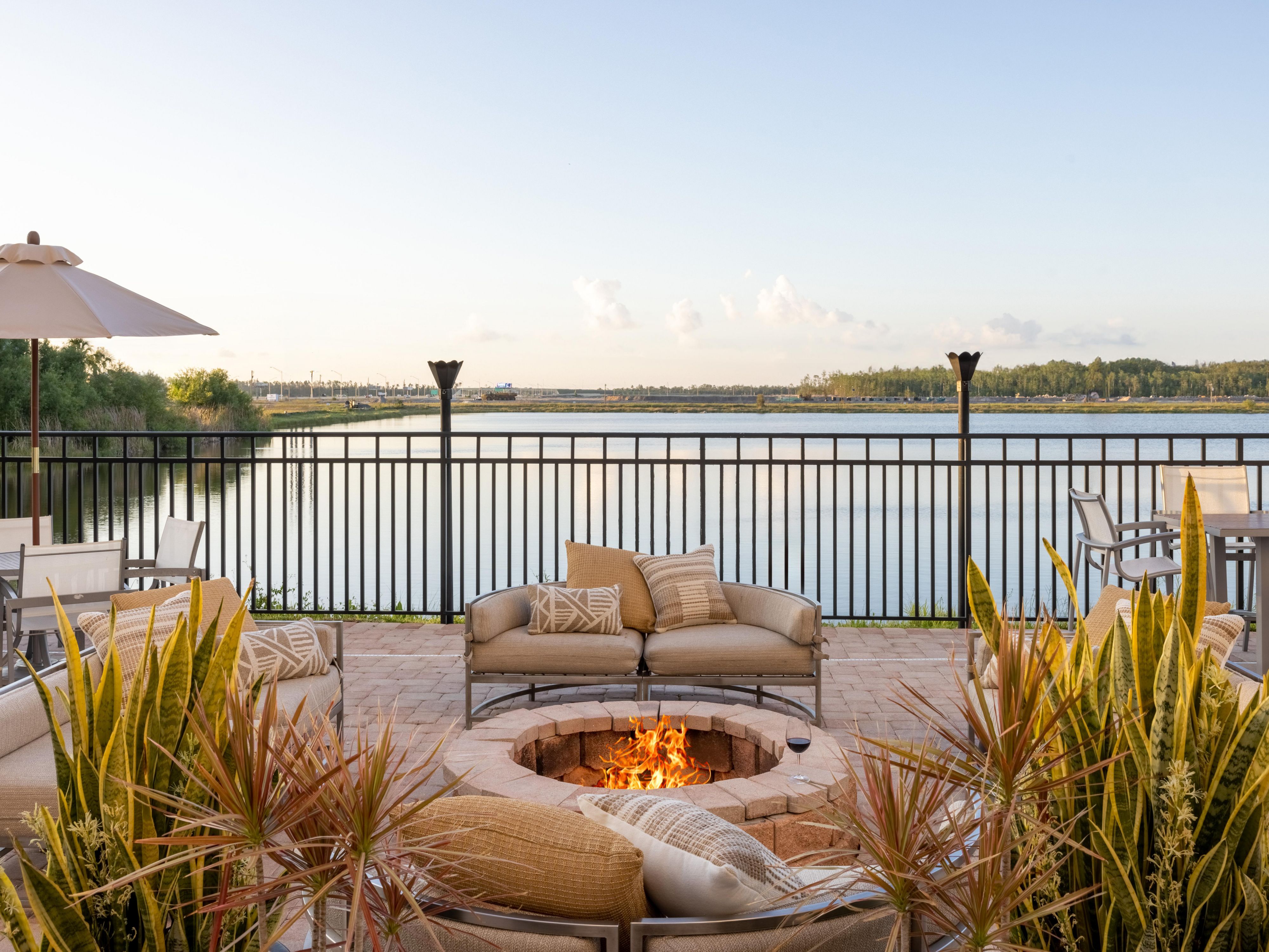 Soak in lake views on our outdoor patio with cozy fire pits.