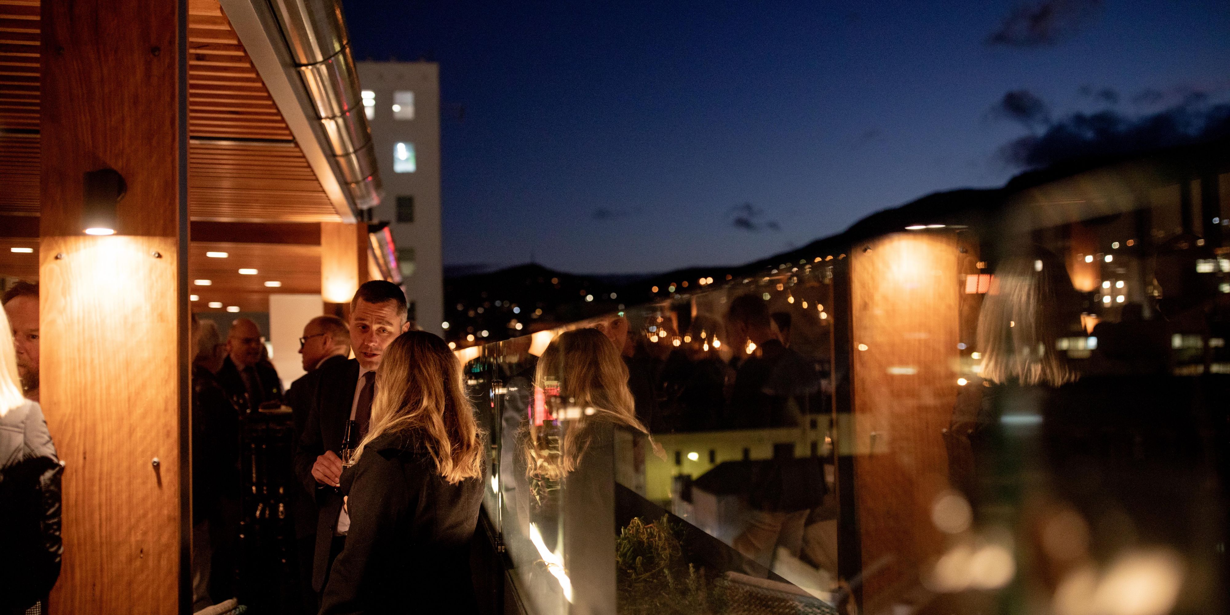Patrons at The Deck at night