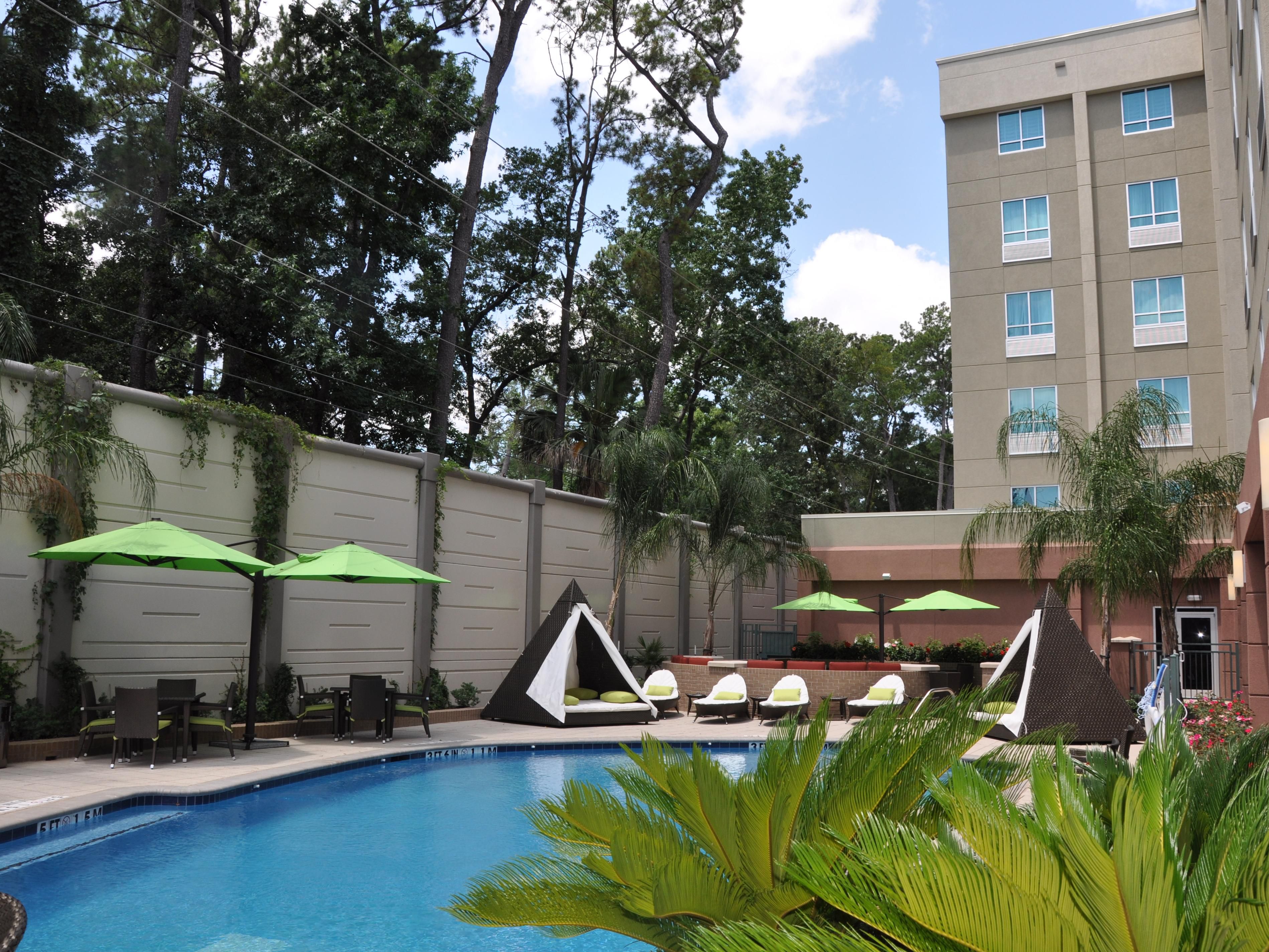 Take a refreshing dip in our outdoor pool under the Texas sun.