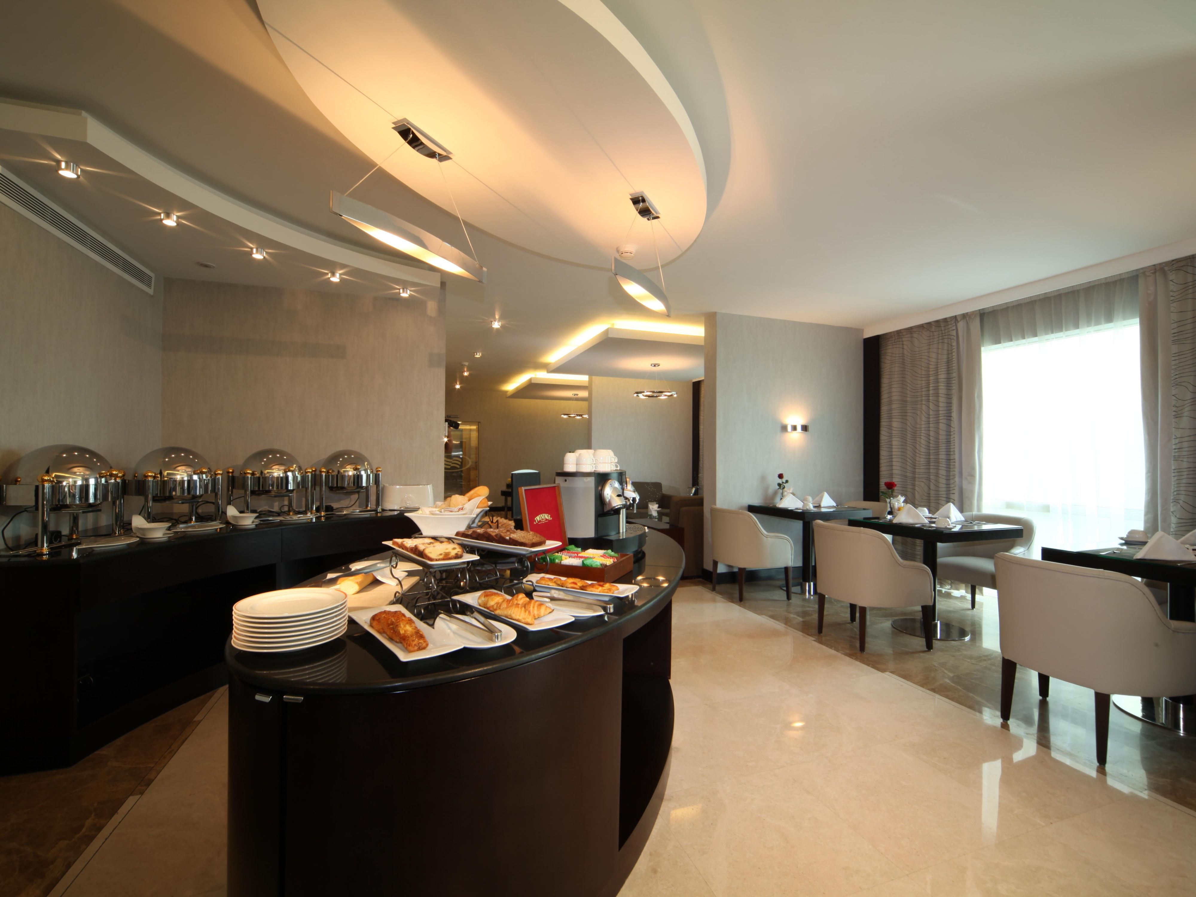 The Club Lounge at Crowne Plaza Jeddah, our hotel in Jeddah city, offers a refined sanctuary for guests seeking comfort, privacy, and attentive service. The Lounge provides an elegant setting for relaxation, catching up on work, or holding informal meetings. Enjoy refreshments, including snacks and beverages, served throughout the day.