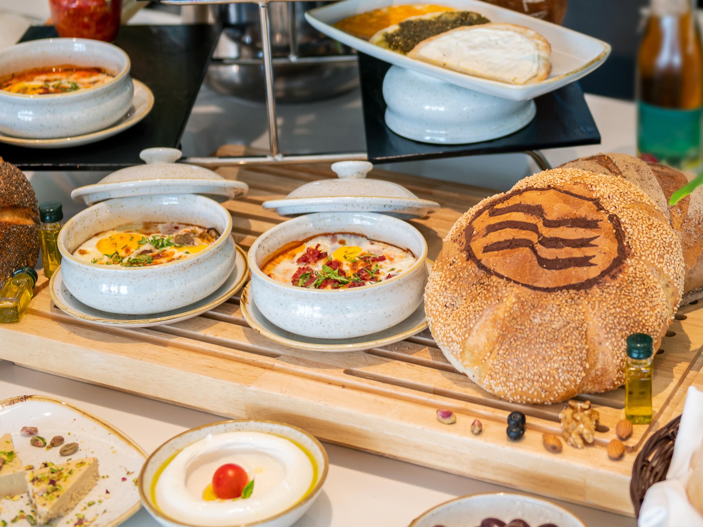 Did you miss breakfast during your stay? Try our breakfast promotion and enjoy your choice of Breakfast Tagine: Turkish Tagine, Vegetable Tagine, Bresaola Tagine, or Foul Tagine Each served with your selection of Labneh, Zaatar, Cheese Manakish, and a side of olives, halawa, Labneh, and fresh Arabic bread.