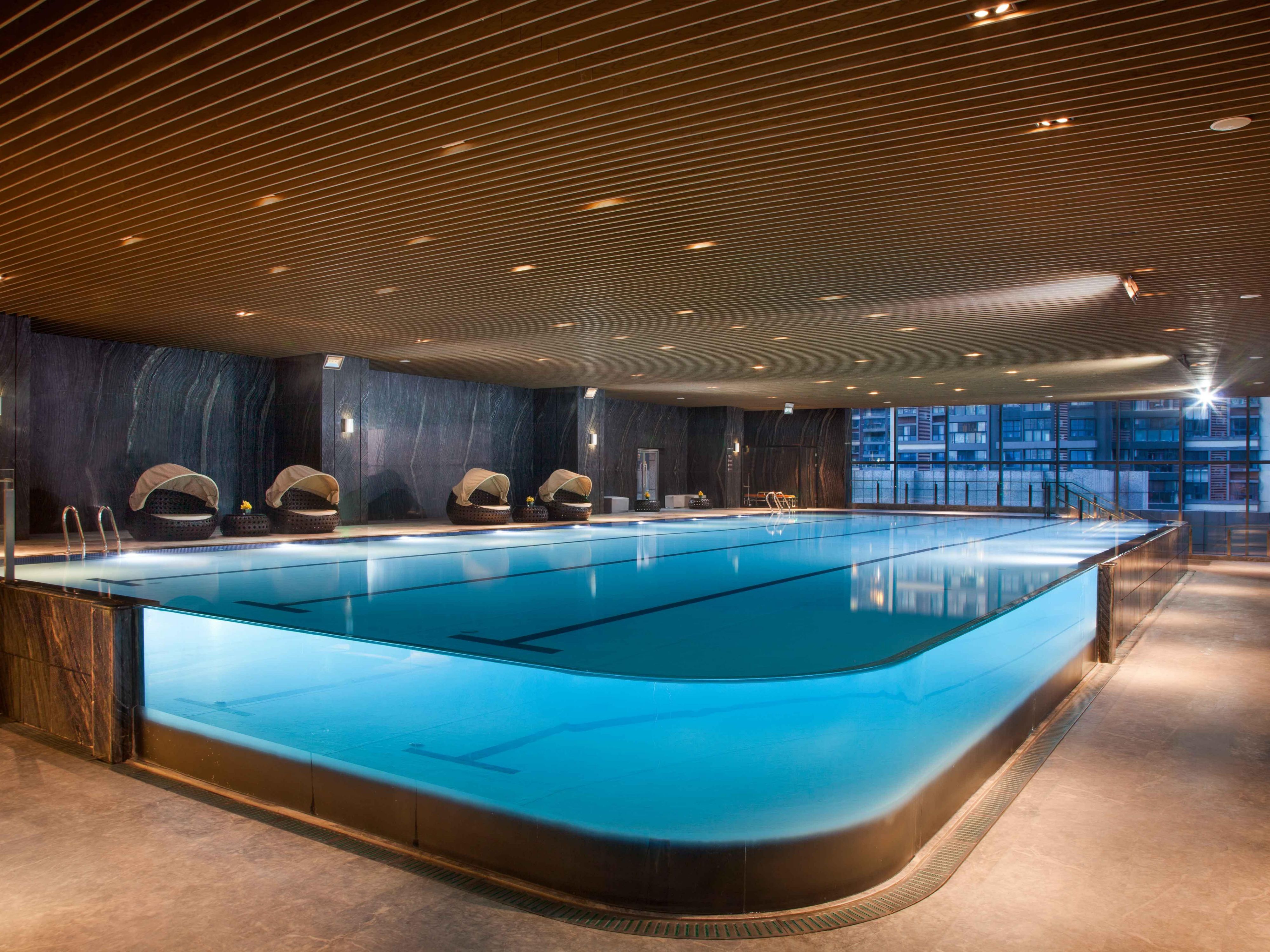 The infinity pool, with its seamless connection to the surrounding environment, creates a striking visual impact and offers an unparalleled experience.  Its impeccable aesthetics attract a multitude of guests who seek to capture unforgettable moments, particularly during peak tourist seasons.  The enduring popularity of this pool is a testament to