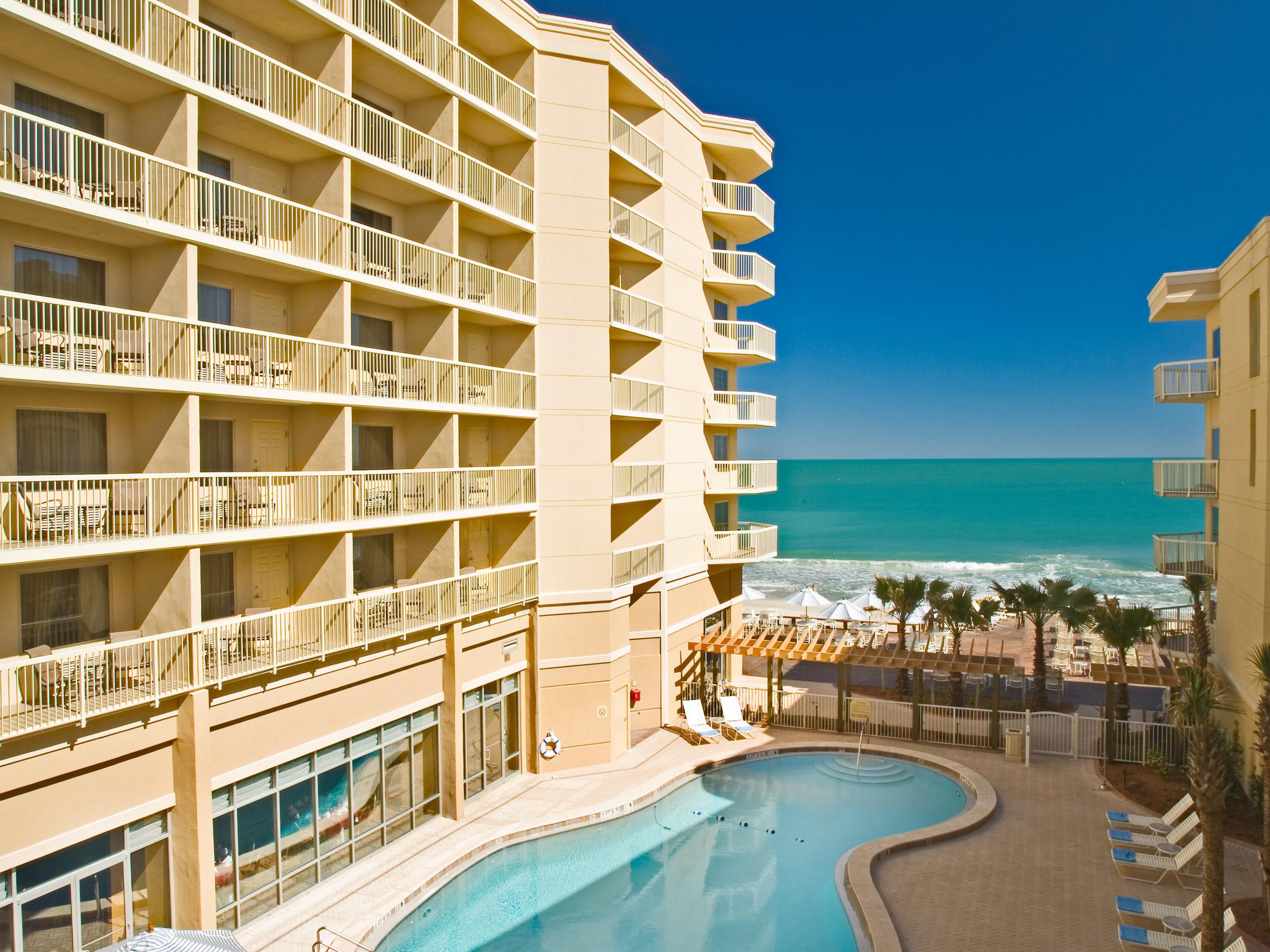 Head to our hotel's Fitness Center to stay on top of your workout routine. Our gym features a wide array of fitness equipment, including ellipticals, treadmills, stationary bikes, and free weights. Later, take a refreshing dip in the heated outdoor pool or head to the beach and lie out in the warm Florida sun before diving into the Atlantic Ocean. 