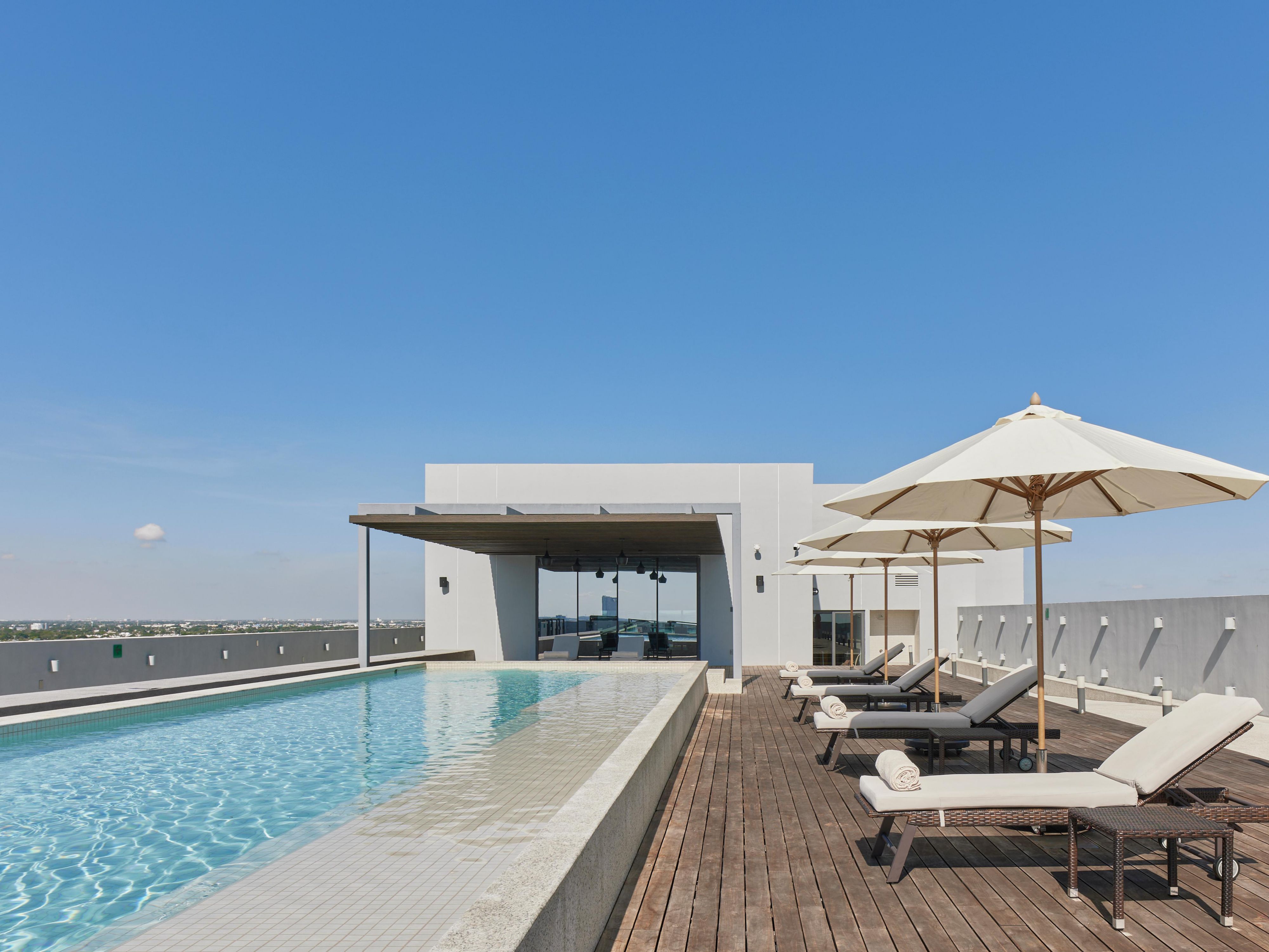 Outdoor pool in Mérida hotel, perfect for relaxation and comfort