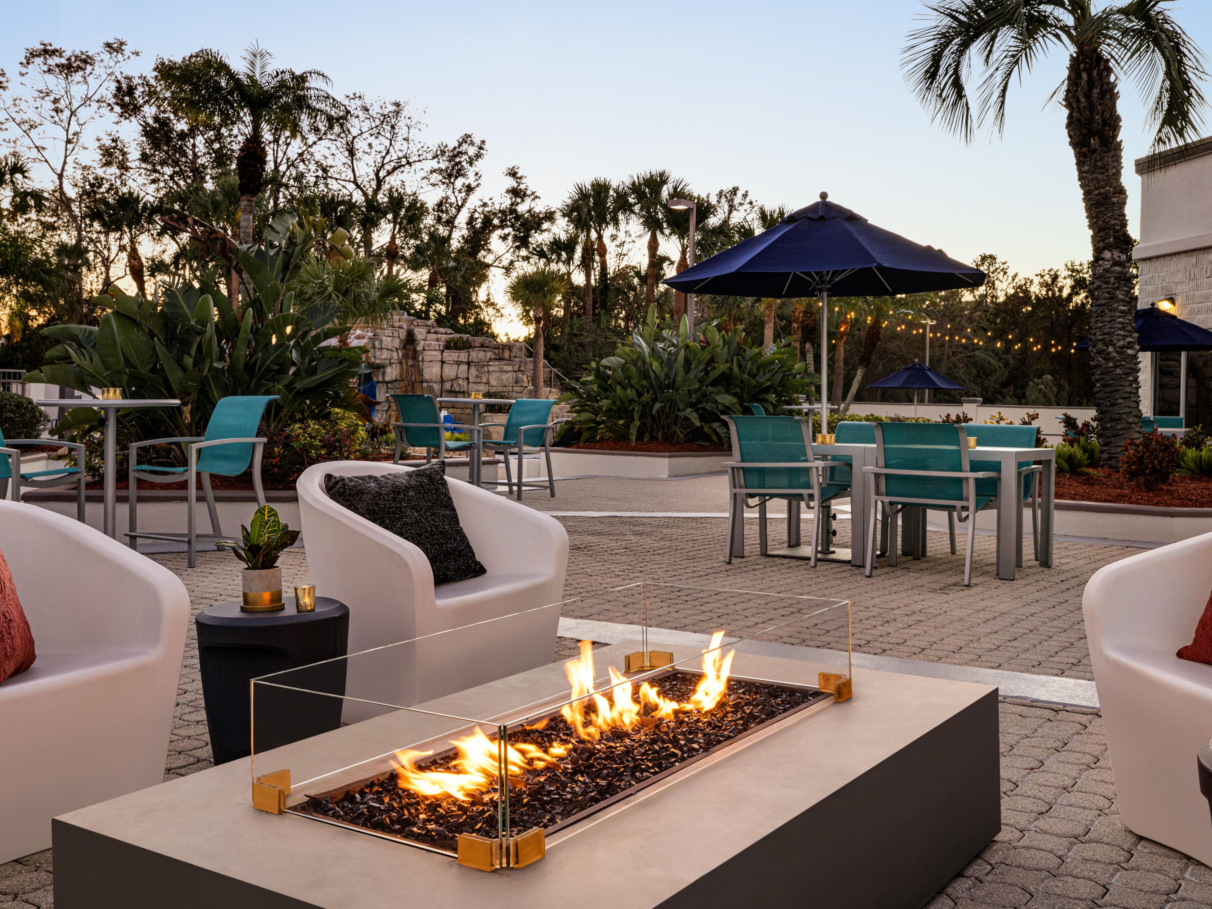 Enjoy the Florida weather seated by the firepit on the pool deck