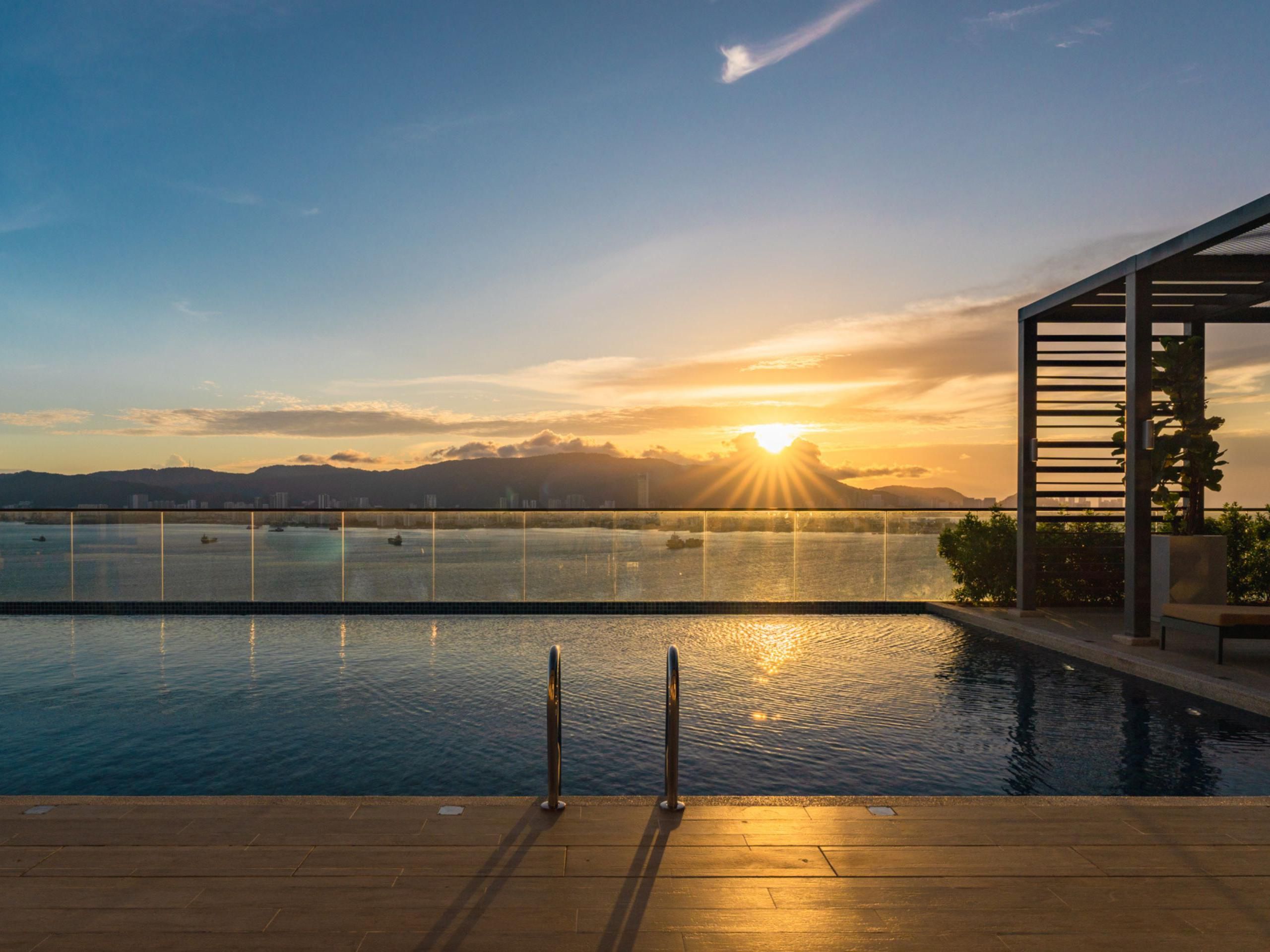 Rooftop Infinity Pool with sunset