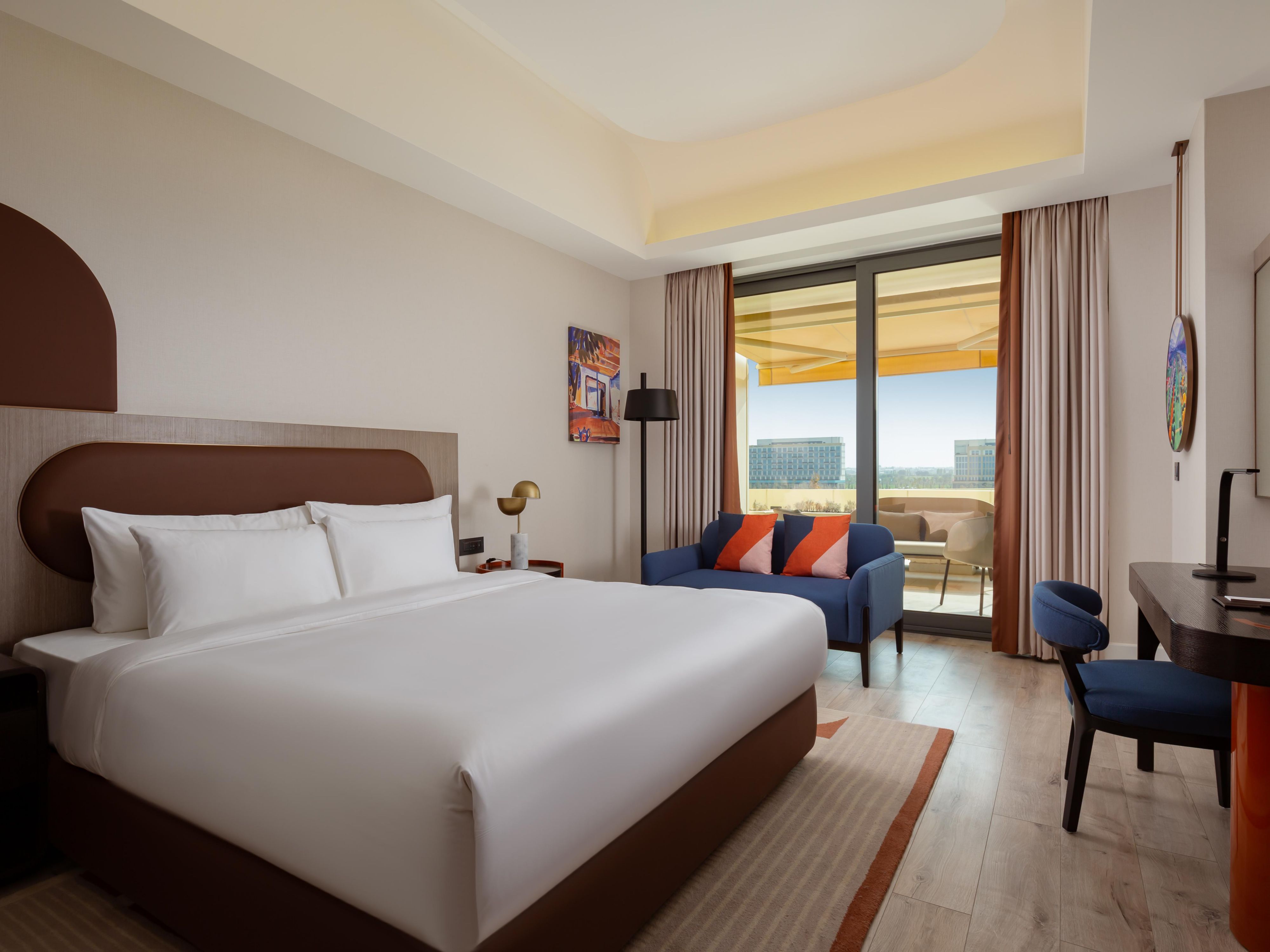 Guestroom with a panoramic balcony offering stunning views.