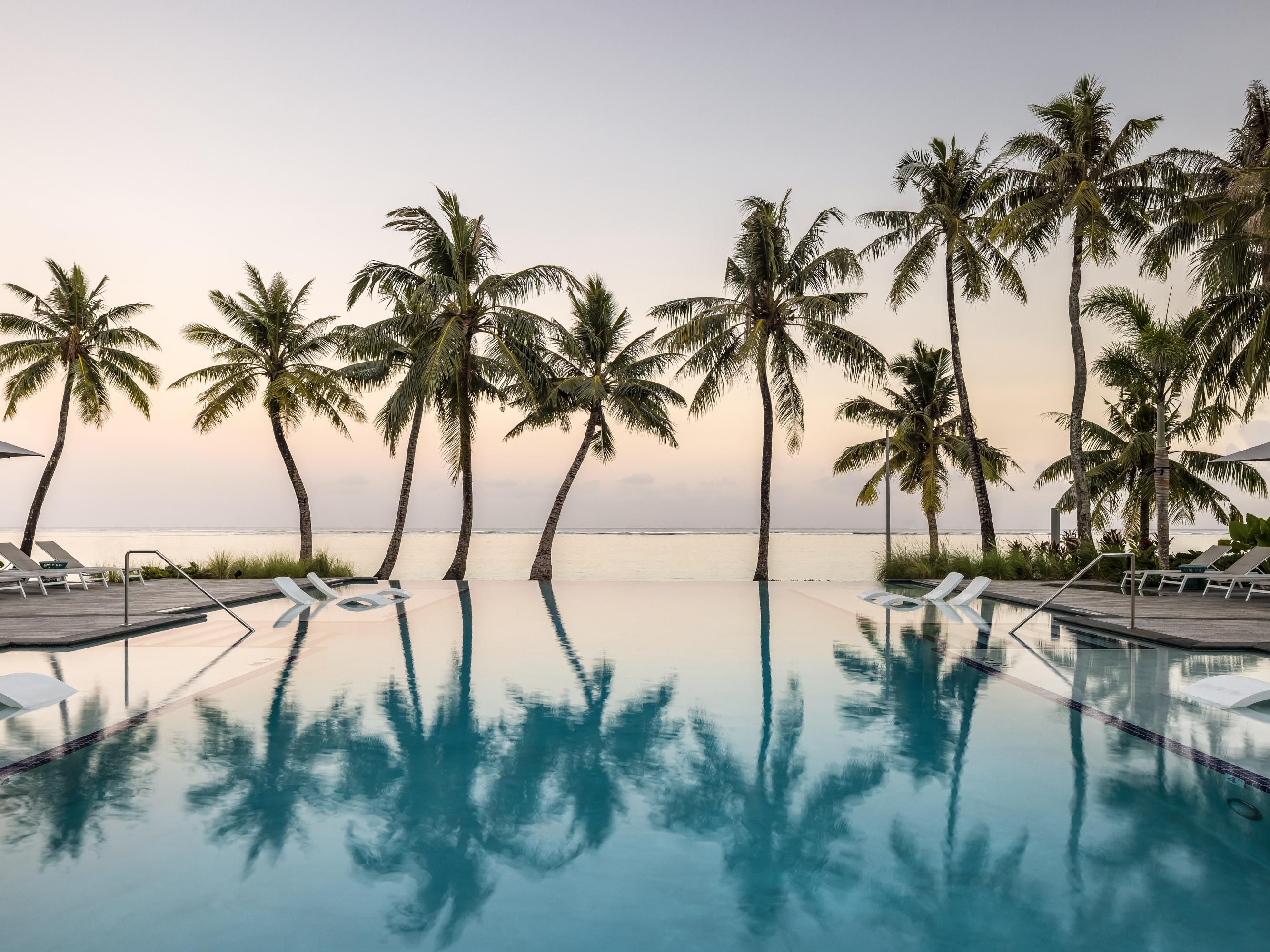 Relaxing at the pool and admiring a stunning sunset view