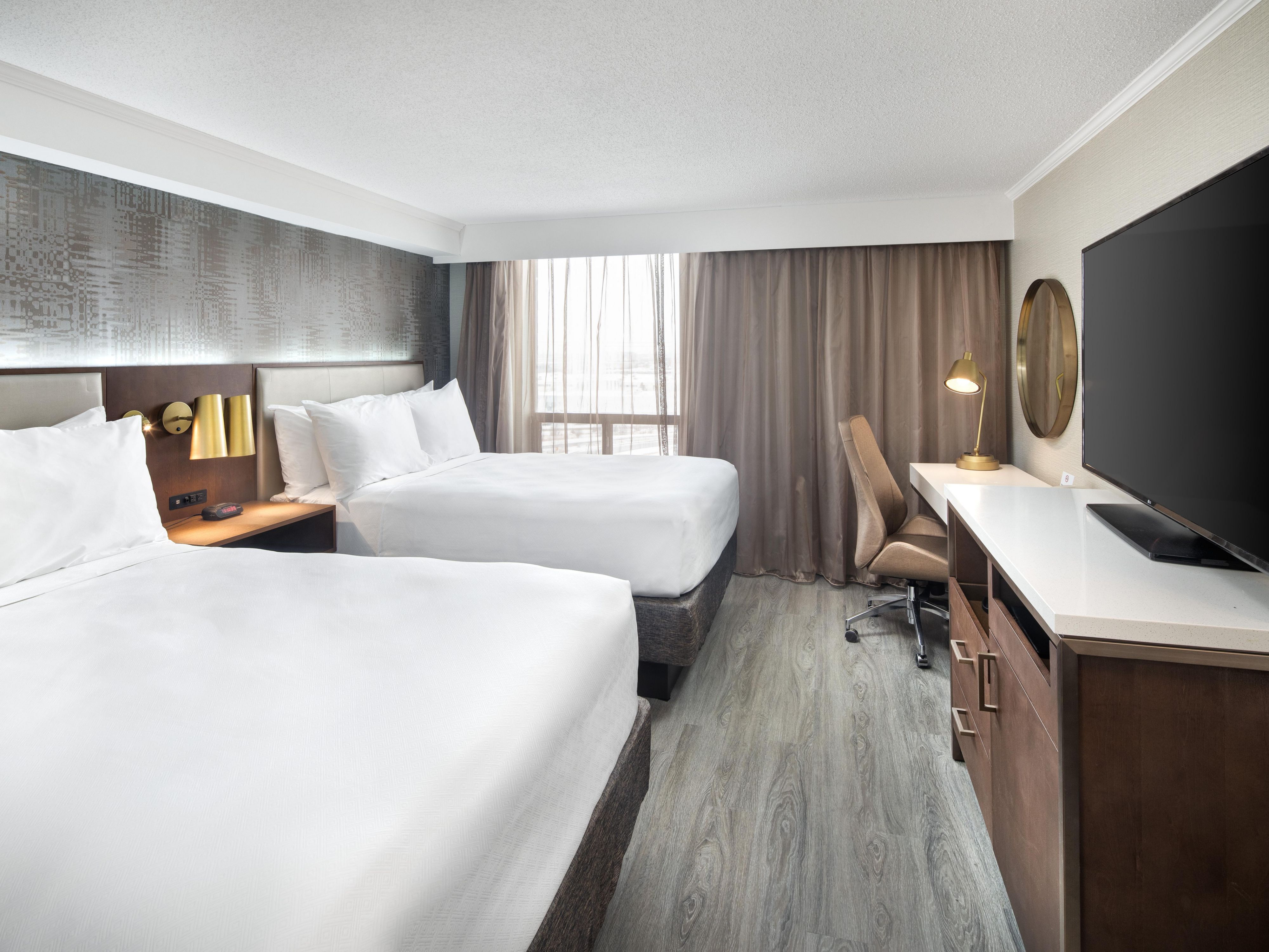 Unwind in our renovated rooms with plush double beds. 