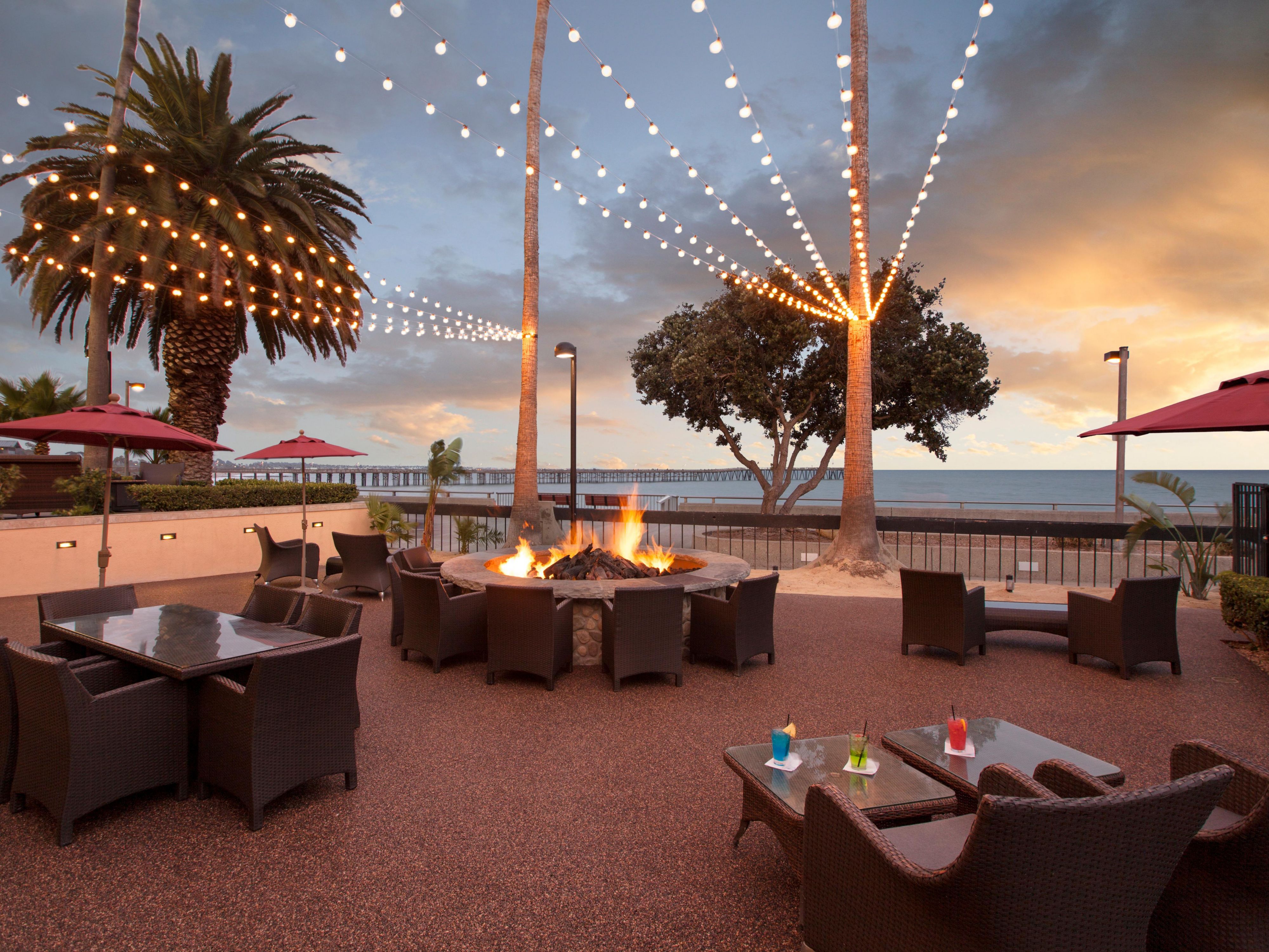 Soak in ocean views from our 2,500 sq. ft. Lanai. Perfect for cocktail parties, intimate weddings, and social events. Adjacent to Aqua Beachfront Bar, this breezy outdoor space features a fire pit, ambient lighting, and unforgettable sunsets over the Pacific. Ideal for any gathering!