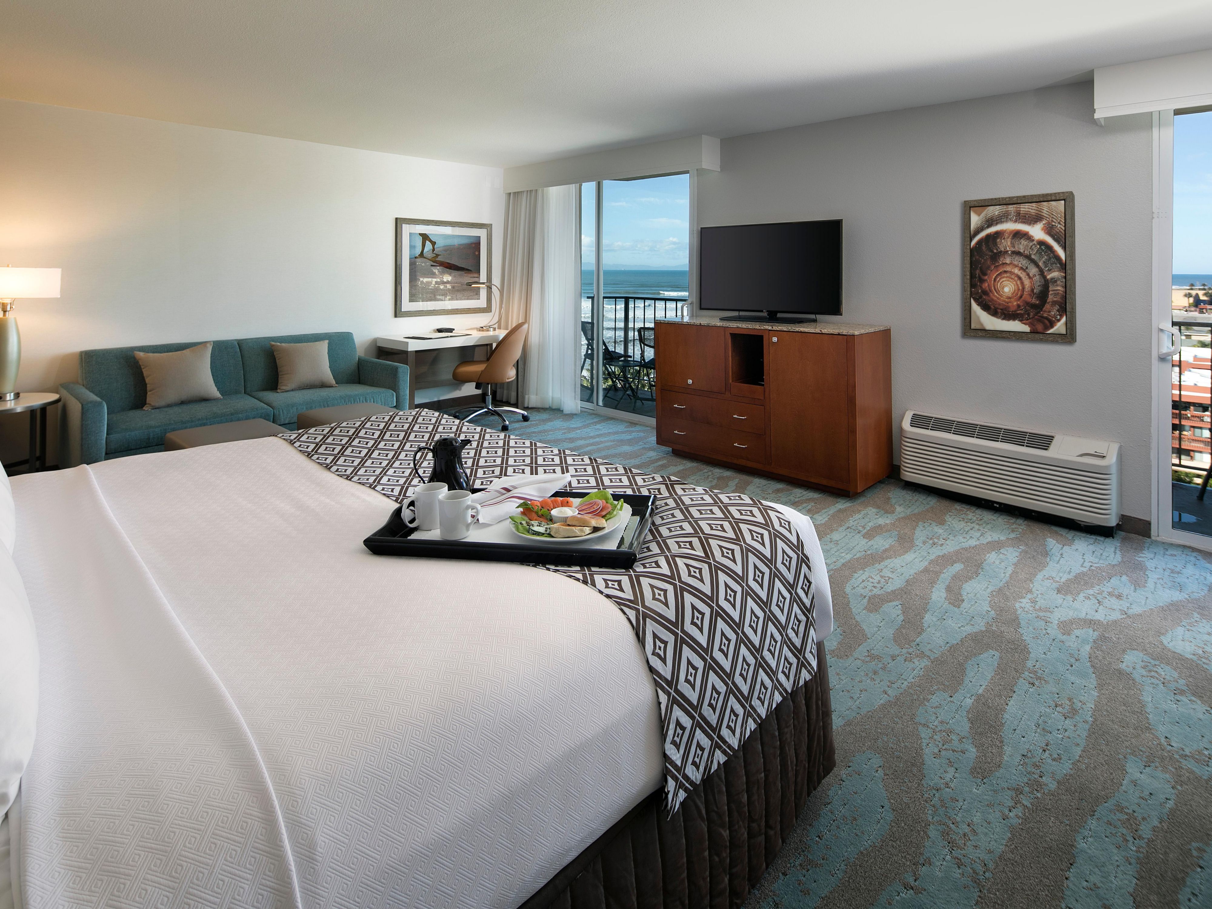 Enjoy Our King Suite With Balcony And Ocean Views At Crowne Plaza
