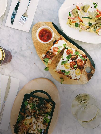 overhead view of plates with appetisers and colourful ingredients