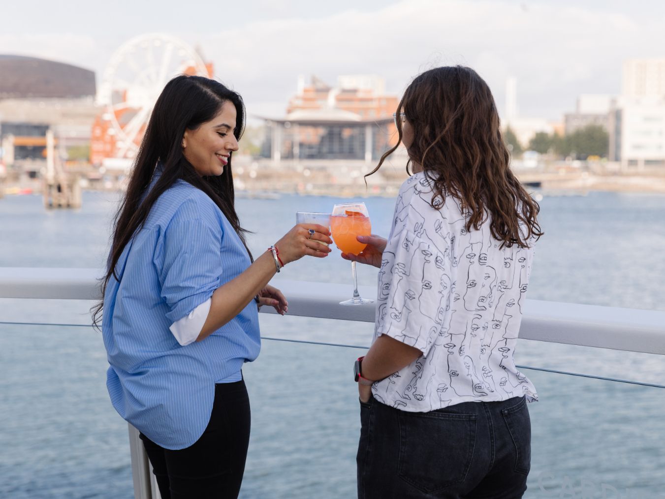 Friends enjoying a beverage on the terrace