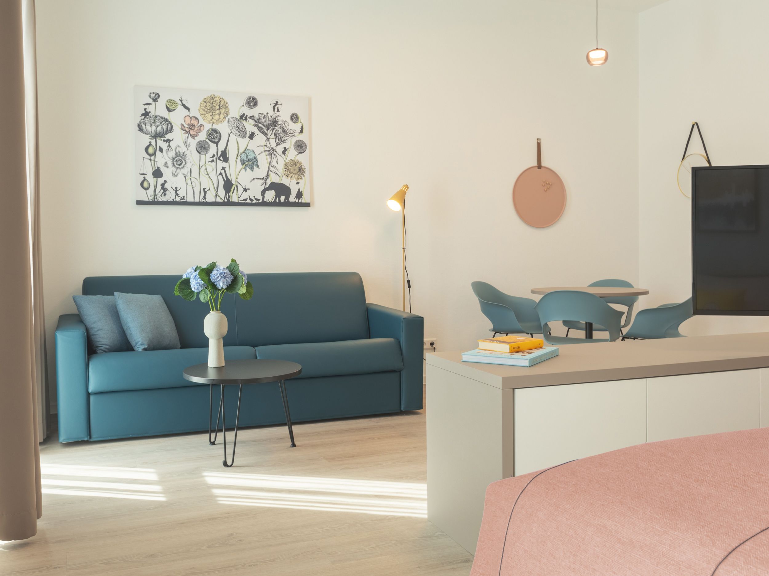 Hotel bedroom with king-size bed, TV, desk and chair