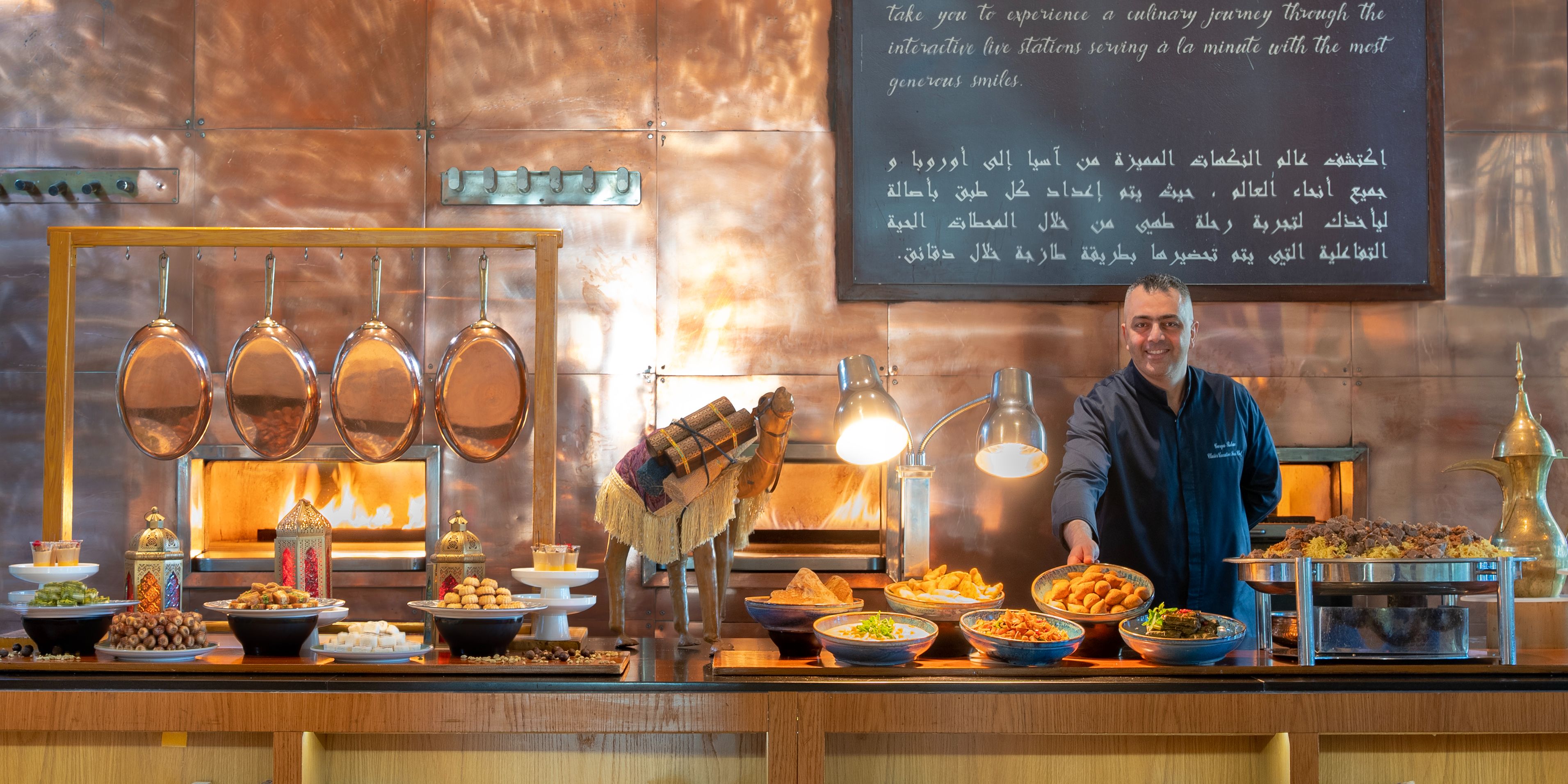 Server standing behind the buffet at Anise.