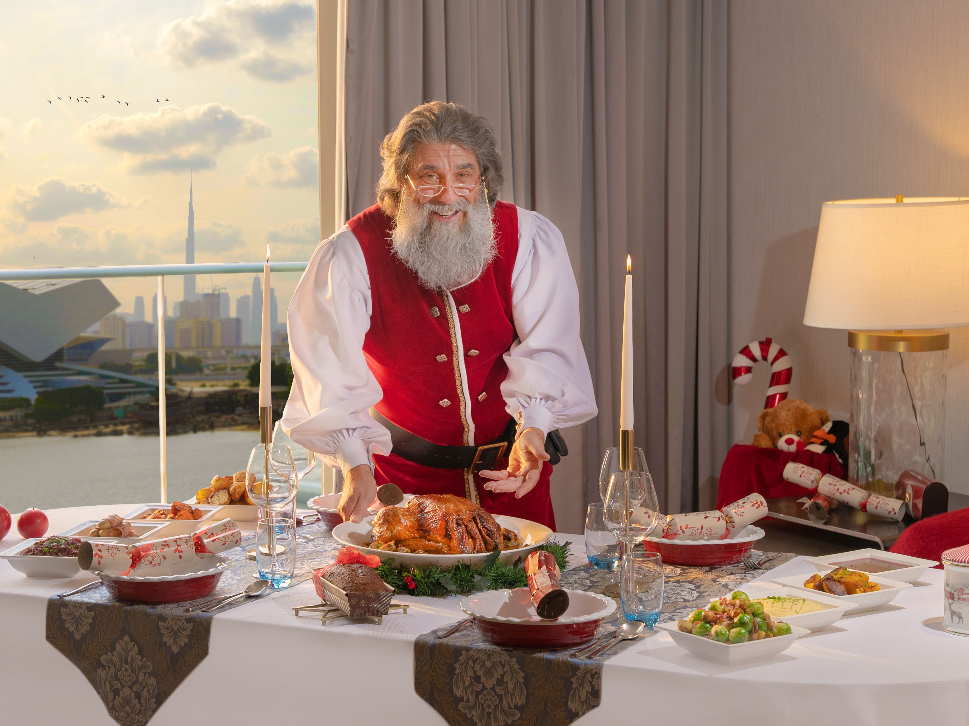 Santa presenting a Christmas dinner.