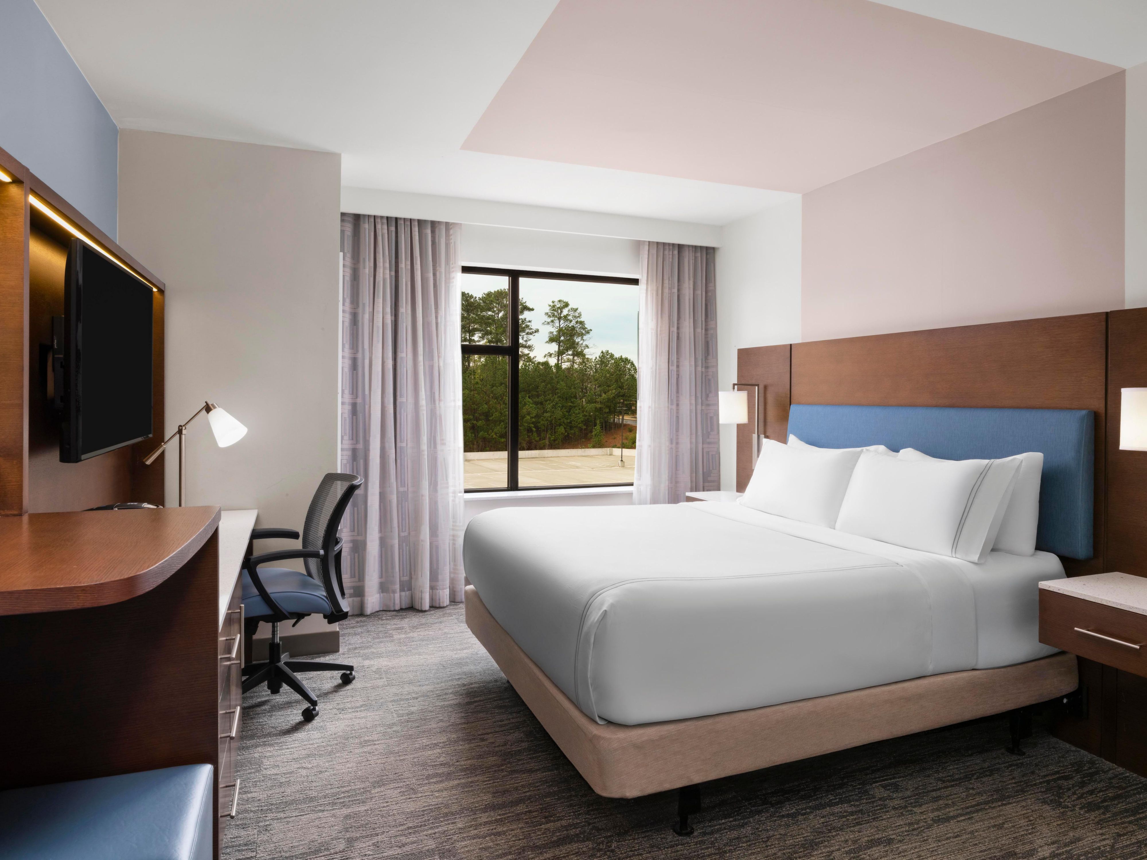Rest well in a modern king room with a spacious desk area