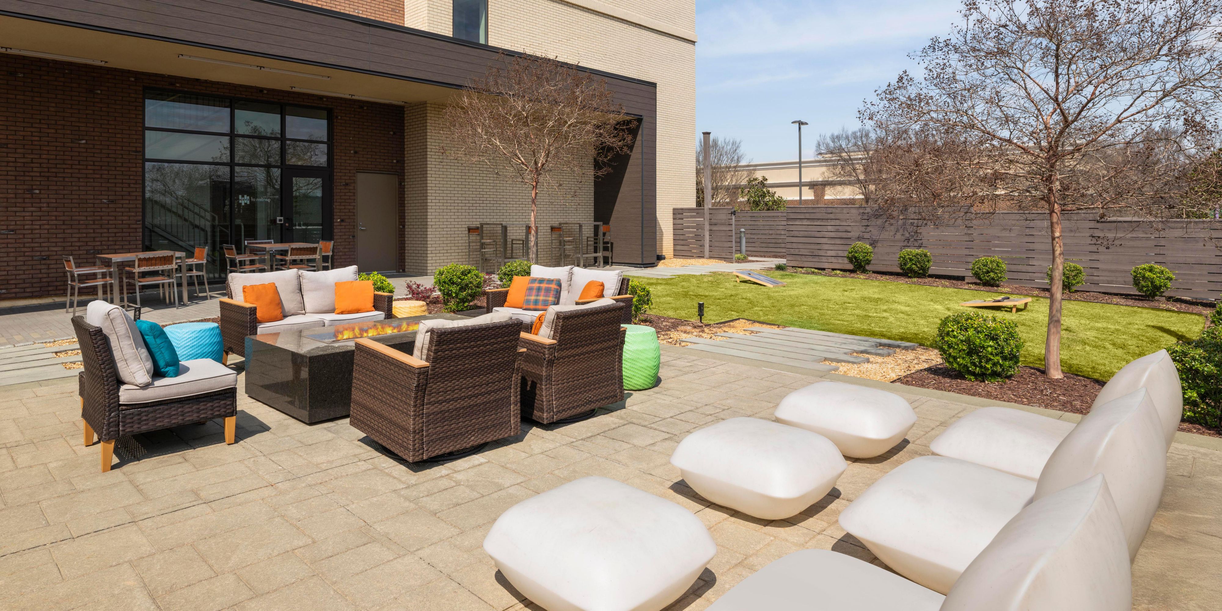 outdoor patio during sunset with seating and games.