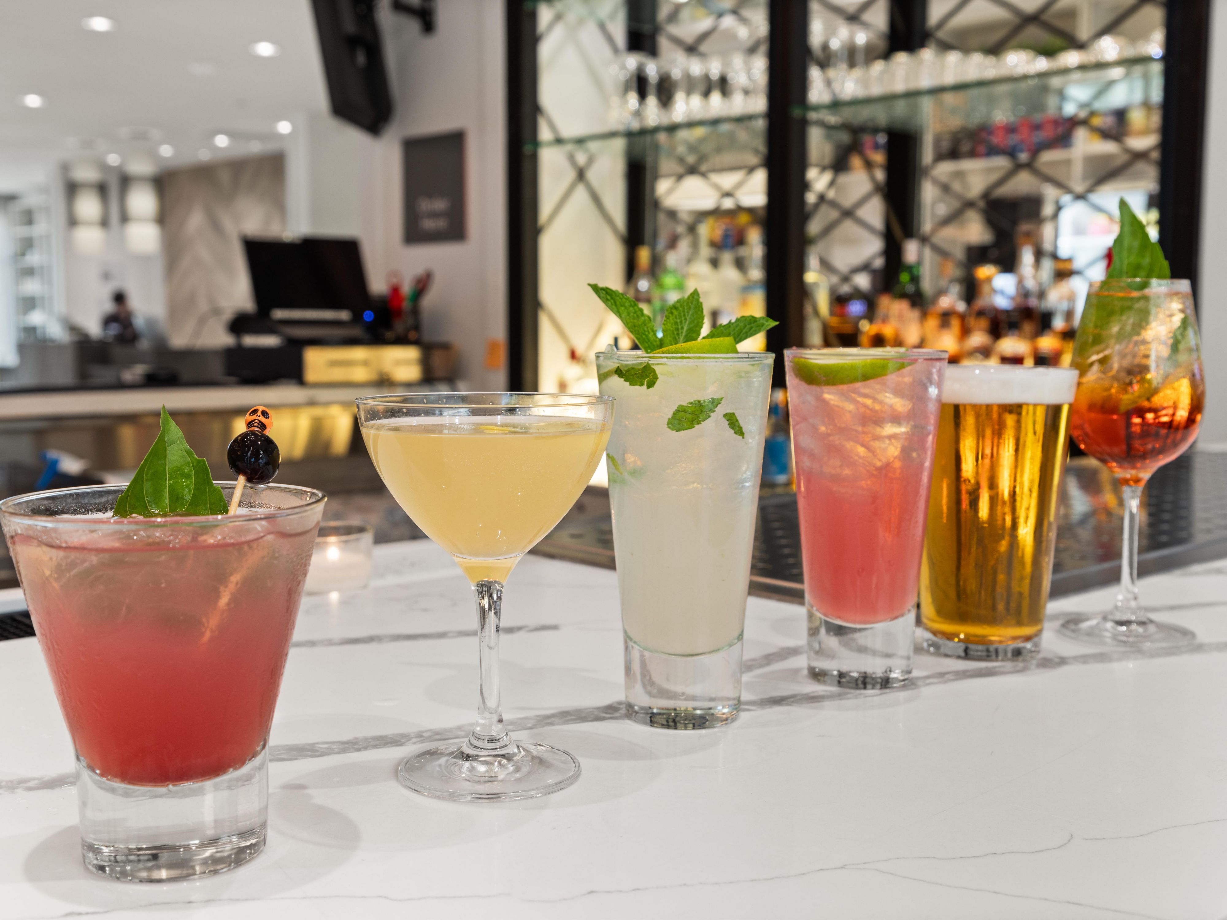 Step into our Austin hotel bar and savor the finest libations and liquid delights. From signature cocktails to craft beer, fine wines, and specialty drinks, our experienced bartenders showcase the art of mixology. Whether you're looking to unwind or raise a glass to life's special moments, EVEN Kitchen and Bar is the place to be.