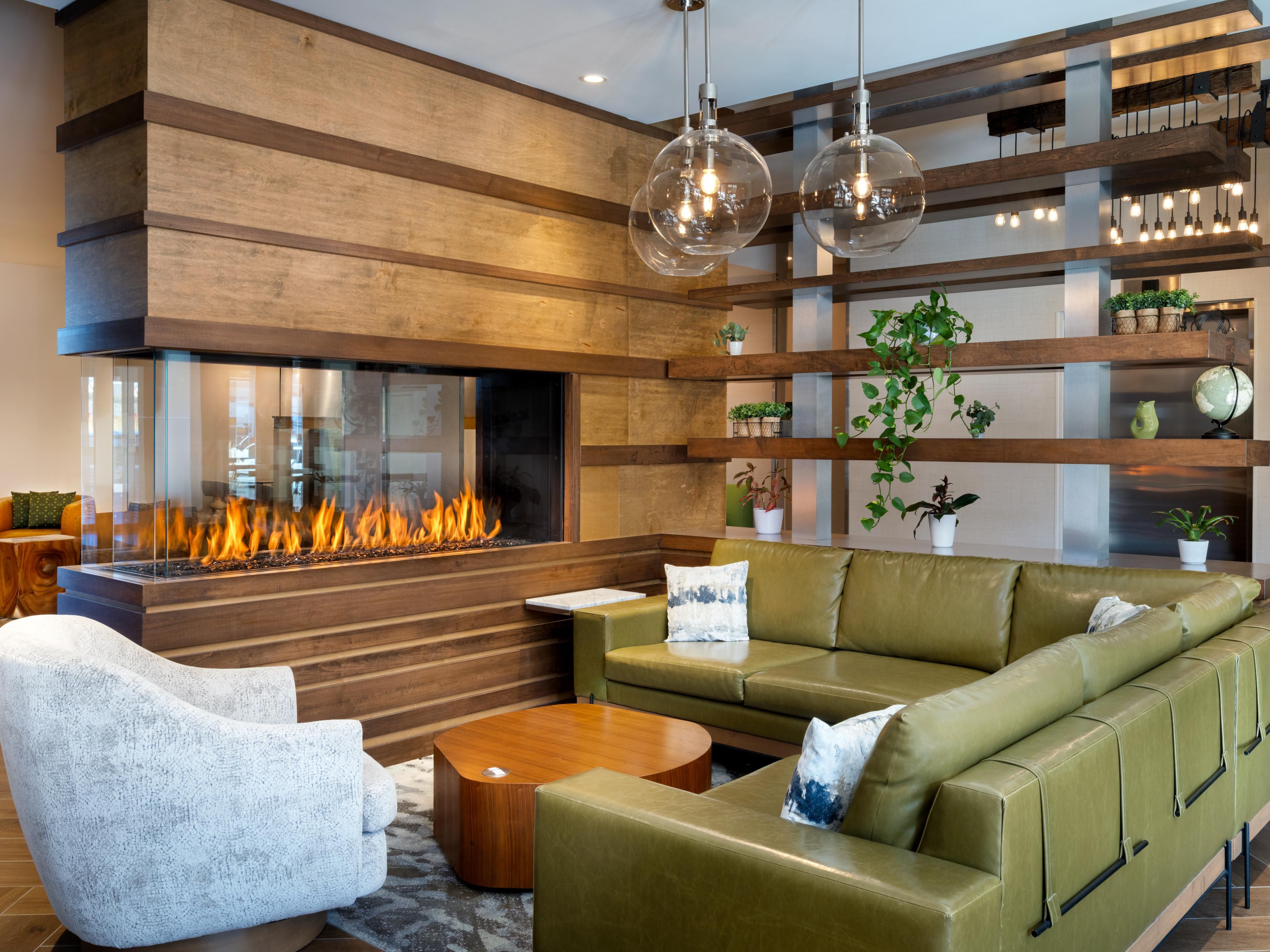 Cozy up by the fire in the stylish lobby at EVEN Hotel Bozeman.