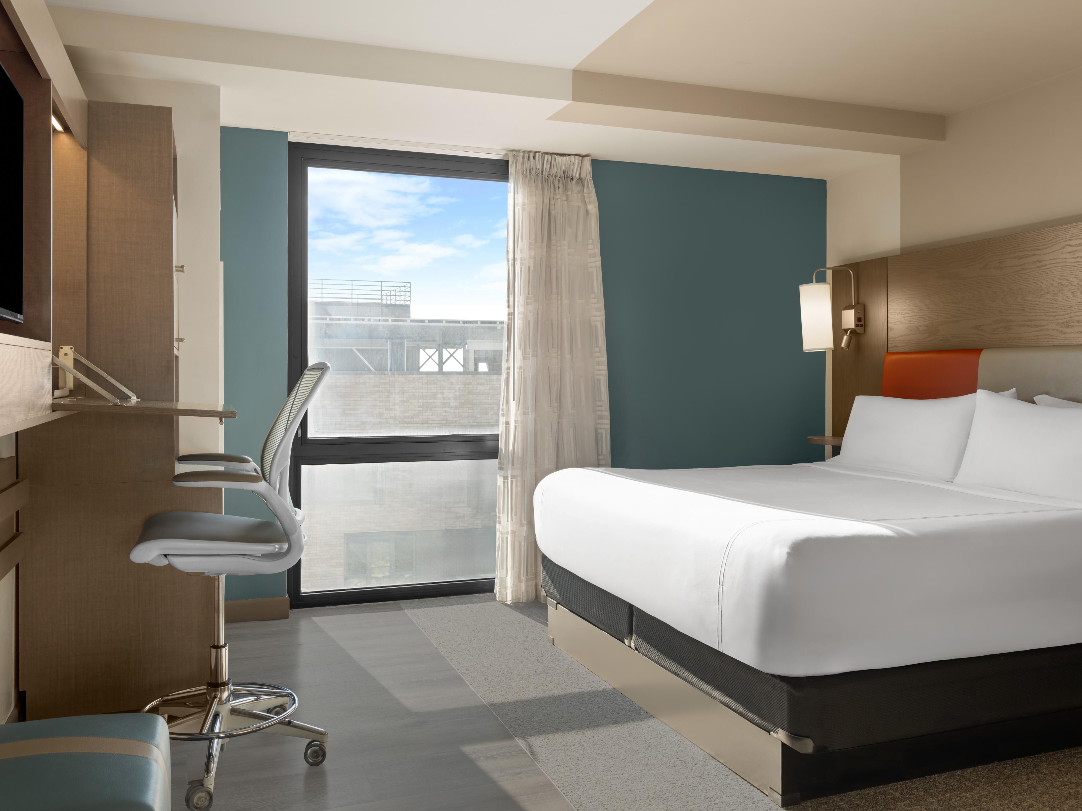 King premium room with workstation and skyline views