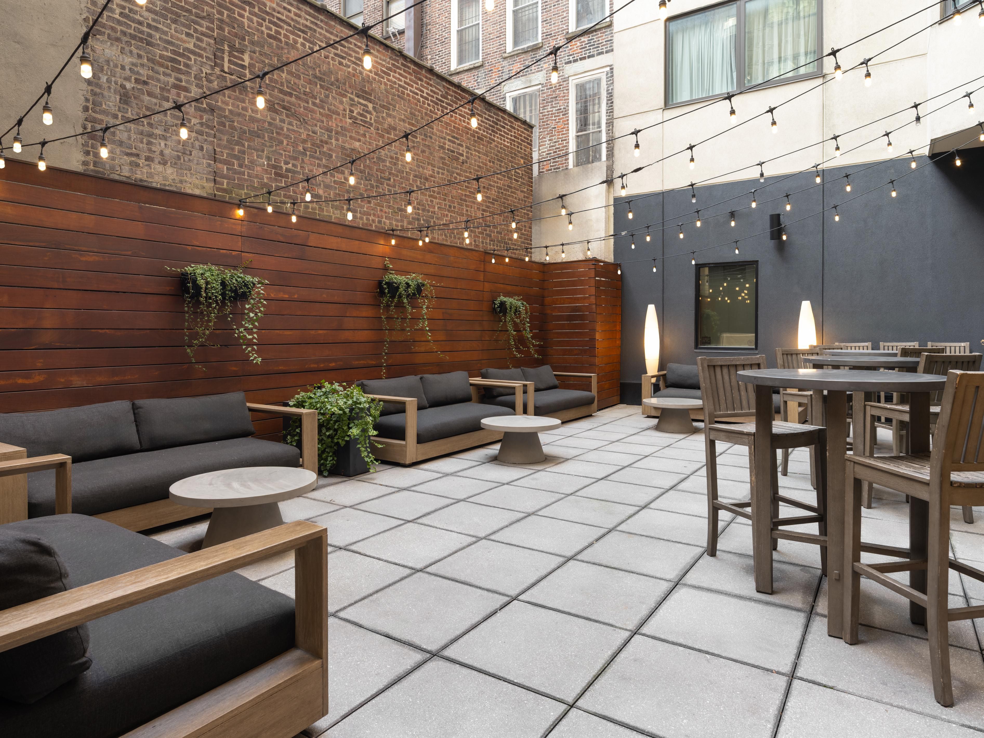 Outdoor patio space with seating.