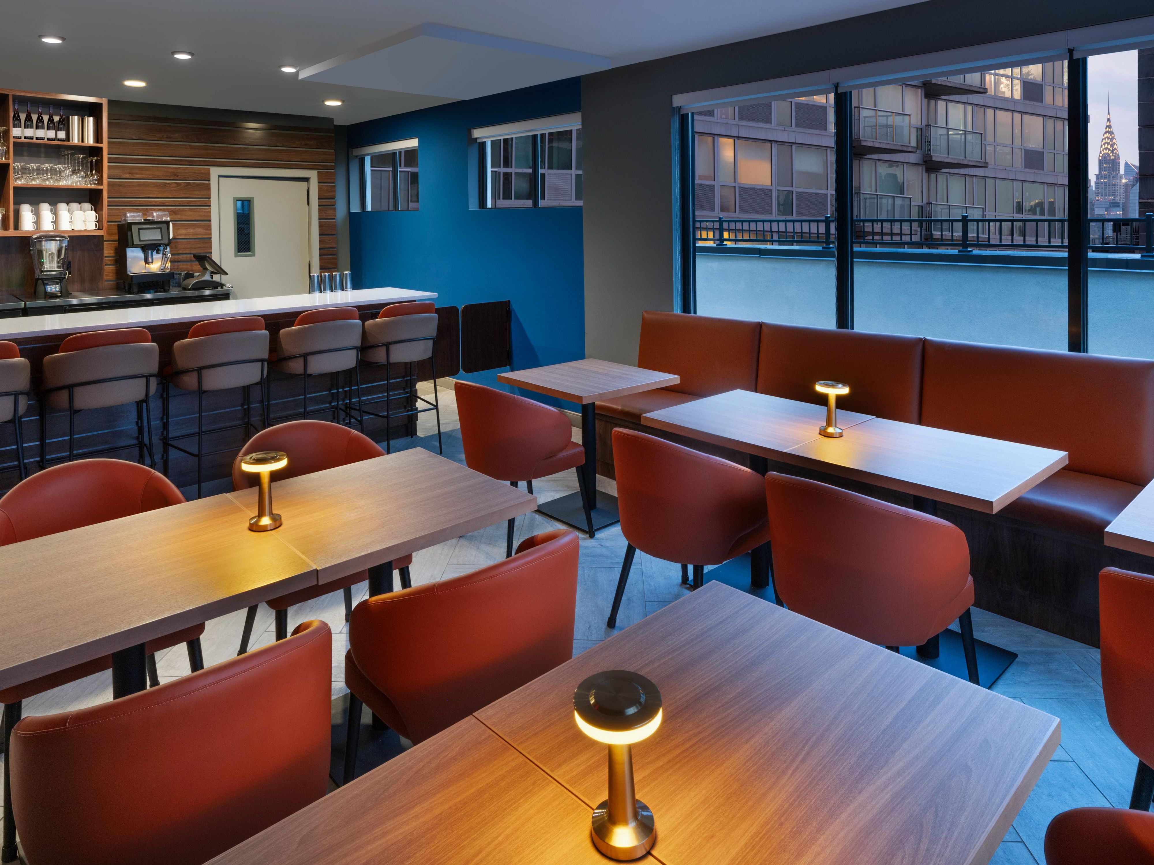 Host your next business or social gathering in our modern rooftop lounge, with 2,000 sq ft of luxurious event space. Designed to accommodate up to 50 guests, this seasonal venue offers panoramic views, sleek design, and a professional atmosphere, perfect for meetings, mixers, or creative sessions in a contemporary setting.