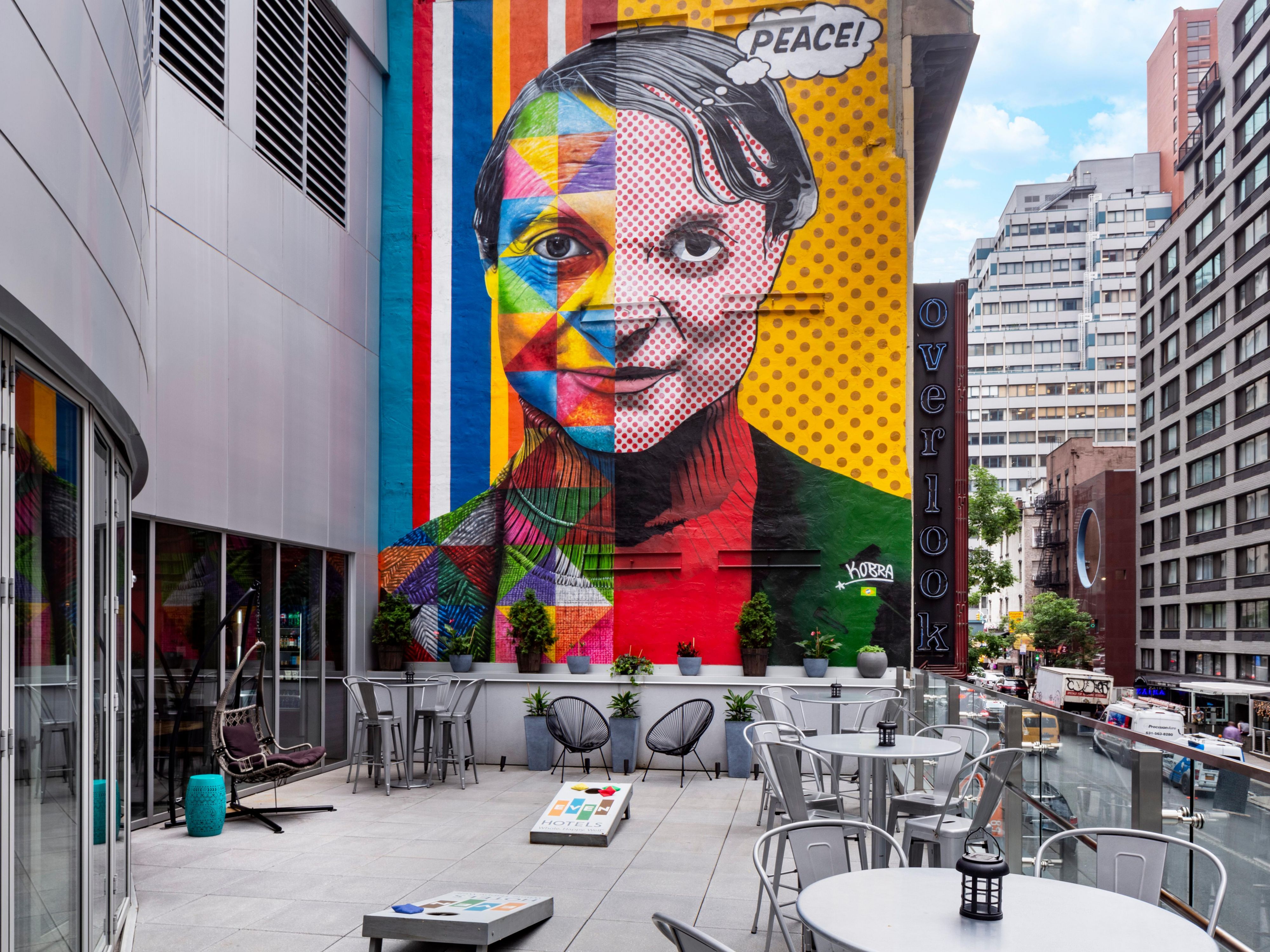 Welcome to our terrace, featuring a mural by world artist Kobra.
